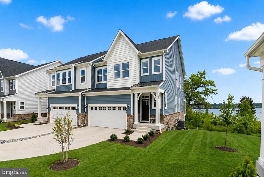 EXCEPTIONAL WATERFRONT OFFERING | LUXURY KITCHEN PACKAGE | HOT TUB + SCREENED-IN DECK! Welcome to 1907 Waters Landing Dr; your opportunity to own the most coveted home in Waters Landing! Built in 2024 and generously enhanced by the current owners, this nearly new, end-of-group villa offers buyers a turnkey opportunity in an outstanding location. Perfectly positioned on arguably the best lot in the neighborhood, this home features stunning due-east exposure with breathtaking sunrise views over Hopkins Creek and Middle River. Enjoy unobstructed water views from multiple sides of the home, with a protected conservation area behind the property ensuring your views remain forever pristine. Step directly from your backyard to the water, or take a short trip by boat to the Baltimore Yacht Club and the Chesapeake Bay. Inside, the home showcases high ceilings across all three levels, an abundance of natural light from additional end-unit windows, and a modern open-concept layout designed for both everyday living and entertaining. The gourmet kitchen package anchors the main level with upgraded finishes and appliances, complemented by added pendant lighting and stylish accents. Upstairs, the spacious primary suite features a tray ceiling and a beautifully appointed en-suite bath. The convenience of upper-level laundry adds to the thoughtful design. The expansive above-grade basement offers incredible flexibility, complete with full-size windows, a rough-in for a full bathroom, and the potential for additional bedrooms or living space, all with direct walkout access to the patio and waterfront. The outdoor living area is just as impressive, with a screened-in composite deck with stairs leading down to a custom ground-level patio; both overlooking the water and perfect for relaxing or entertaining. Additional highlights include an upper level study/office, two-car front-load garage, two-car driveway, and numerous owner upgrades throughout. Located in the Waters Landing community, residents enjoy private piers for boating, kayaking, and paddleboarding, scenic walking paths, and close proximity to Rocky Point Park. Convenient access to I-695 and the MARC train makes commuting simple. This is more than a home; It’s a premier waterfront lifestyle in one of Essex’s most desirable communities.