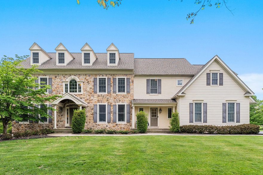 Nestled in the highly sought-after Ashbourne Estates, this stunning Colonial blends luxury, comfort, and everyday livability across more than 4,400 square feet of beautifully designed space. From the moment you step into the grand foyer, the home feels warm, welcoming, and made for both entertaining the most sophisticated events to everyday relaxing and enjoyment.  
The dining room is perfect for hosting gatherings, featuring a gorgeous tray ceiling and a full butler’s pantry with a wet bar and dishwasher for added convenience. The gourmet kitchen is truly the heart of the home, complete with high-end appliances, a commercial-grade side-by-side oven, a striking dark copper hood, and an abundance of granite countertop space. The oversized two-tier island makes entertaining effortless while still being ideal for everyday meals.
The open floor plan flows seamlessly into the spacious family room and expansive casual dining area with views of the open yard, so the chef never misses out on the conversation. The family room features brand-new carpet and a beautiful natural stone fireplace that creates the perfect cozy atmosphere. Looking for a quieter retreat? The formal living room offers oversized windows with private, peaceful wooded views. Just off the living room is a fifth bedroom with its own bath, making it an ideal setup for an in-law suite or private guest suite.  
Upstairs, you’ll find four more generously sized bedrooms, including an incredible primary suite designed to feel like a true retreat. Enjoy a large sitting room, two separate walk-in closets, and a luxurious primary bath featuring two private commodes, a dual entry shower, built-in vanity, and a soaking tub all surrounded by tons of natural light. Two additional bedrooms share a Jack and Jill bathroom while  overlooking the expansive backyard.  The 4th bedroom is such a unique delight boasting a hand crafted coastal mural in it's generous space while also containing its own private full bath.
Need even more room? The finished bonus room over the garage offers endless possibilities and even has room to add another full bathroom for an additional en suite. The sizeable upstairs laundry room adds convenience with extra storage and countertop space. A rear staircase leads down to the mudroom, complete with built-ins, two closets, and a second powder room with easy access to the garage, kitchen or the front of the home. 
The unfinished basement offers an incredible amount of storage and plenty of flexibility for a future gym, hobby room, or finished living space customized to your prefrences. 
Outside, the 1.84-acre lot provides a private, serene setting with a flat backyard perfect for entertaining, play, or simply relaxing. Enjoy evenings on the expansive paver patio or unwind in the hot tub while taking in the peaceful backyard oasis. Utilize the pole barn shed for the exterior maintenence items and leave the 3 car garage for parking your vehicles!  The long driveway provides ample parking and a great space for outdoor basketball! No need to worry about big ticket items.  This home has had a new roof, new garage doors, new grinder pump and a new water heater all in the last few years.  912 Ashbourne truly offers the perfect blend of luxury and comfort, with thoughtful details and versatile spaces throughout. Make it your new home today!
OPEN HOUSES THURSDAY AND SATURDAY WITH PRIVATE SHOWINGS AFTER 2PM ON SATURDAY 5/16.