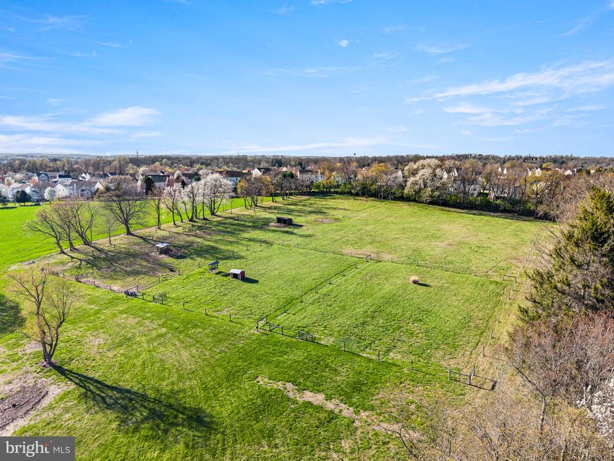 Welcome to 1725 Goosetown Road, a rare and exceptional offering in the heart of East Fallowfield Township, Chester County. This tranquil 58+ acre property features two homes, a workshop, and four well-fenced horse pastures equipped with water, along with open meadows, wooded riding trails, tillable acreage, and a secluded, spring-fed, fully stocked pond. The two-bedroom, one-and-a-half-bath main house offers a rustic log-style interior with both original wood accents and thoughtfully incorporated reclaimed barn wood, creating a warm and inviting atmosphere. The home has been renovated with tremendous care and intention, blending unique vintage touches with modern conveniences throughout. At the heart of the home is a true chef’s kitchen, featuring a commercial-grade 48-inch JennAir gas range with double ovens, a pot filler, wine fridge and new cabinetry with soft-close drawers, all complemented by concrete countertops.
From the dining area, French doors open onto a patio that is perfect for morning coffee accompanied by birdsong, grilling with the family or a glass of wine while taking in the spectacular sunsets.  The main house has been thoughtfully updated with a metal roof, new windows, a propane heating system, a new well pump, and the addition of a tankless on-demand water heater—all within the last two years—ensuring efficiency and peace of mind. With all major systems already addressed, only a few cosmetic finishing touches remain.  
The property also includes a three-bedroom, one-bath guest house. This residence was fully updated just two years ago with a new metal roof, new windows, updated kitchen and cabinetry, fresh paint, and new flooring. Additional amenities include a 600 sq. ft. heated and air-conditioned garage/shop, along with an RV pad offering electric, septic, and water hookups. Three separate electric meters service the main house, guest house and RV pad/garage. Whether you’re an equestrian, nature lover or outdoor enthusiast, this property offers an exceptional lifestyle. For those who enjoy hunting, the peaceful landscape provides an ideal setting for scouting and harvesting trophy bucks. The privacy is unmatched. Perfectly positioned for both privacy and convenience, the property is located just 3 miles from the SEPTA Thorndale train station and offers easy access to major travel routes, Coatesville Airport, as well as nearby shopping, restaurants and banking. While the property lends itself beautifully to a private country estate, family compound or horse farm, it also represents a compelling investment opportunity. All building rights remain intact, offering significant potential for future development or subdivision. With multiple access points, favorable zoning, and proximity to growing retail and commuter hubs, this is a rare opportunity to create a thoughtfully designed residential community in a serene, natural setting. The property also includes an existing barn structure with 6 stalls and room for more that may offer future potential depending on the buyer’s vision. Please note, the property consists of eight separate tax parcels and is being sold as one. It is also enrolled in Act 319 (Clean and Green program), which provides significantly reduced property taxes. The listing agent must accompany all showings, and buyers are required to provide proof of funds or pre-approval. There is no sign at the property, and it is located at the end of a long driveway. Access is not permitted without the listing agent present. Please be respectful.