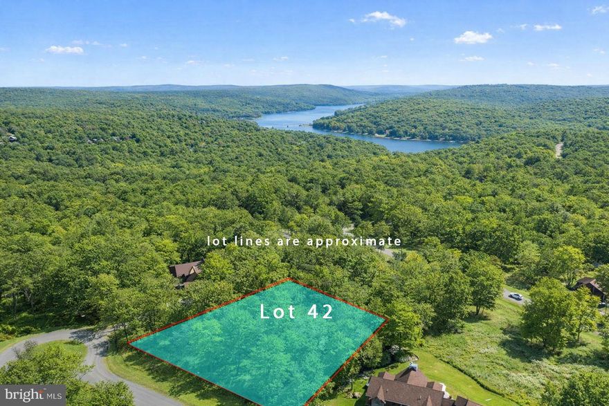 Discover an exceptional opportunity at Lot 42 Sandstone Circle in the prestigious Lodestone community. Level, wooded homesite positioned just steps from the renowned Lodestone Championship Golf Course, offering both privacy and refined mountain living.
The approved half-acre parcel is fully prepared for your custom residence, with public utilities available at the lot line. Nestled in the heart of Wisp Mountain Resort, this premier location delivers effortless access to four-season recreation, while being just minutes from the pristine waters and amenities of Deep Creek Lake. An extraordinary setting for a distinguished mountain retreat. Call today for plat and additional details.