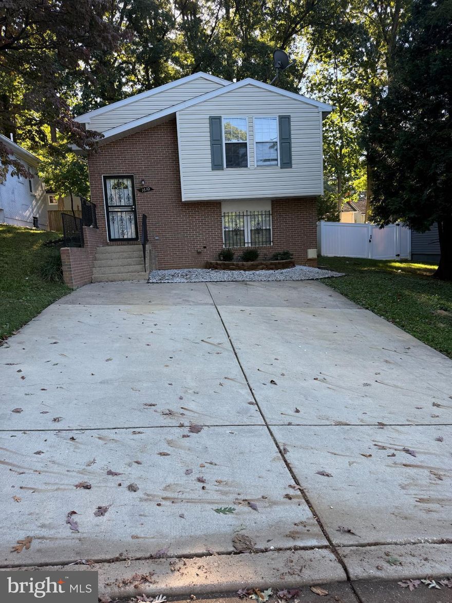 This well maintained property offers comfort, privacy, and functionality throughout. It features a driveway that can accommodate two vehicles and a fully finished lower level with both an individual entrance from the outside and interior access from the main level, providing flexibility and convenience. The lower level includes a kitchenette area, updated cabinets, a sink, and a washer and dryer. The home offers spacious bedrooms, including one with a private bathroom that provides extra comfort and privacy. Located in a quiet and established residential area, this property is move-in ready and offers a comfortable and practical living environment.