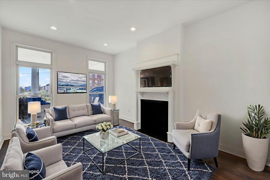 This house is a total 6 7! Discover a perfect blend of charm and modern living in this exceptional Harwood residence. This 4-bedroom, 2.5-bath interior row home welcomes you with a spacious kitchen featuring elegant shaker cabinets and a beautiful exposed brick wall.

Upstairs, the primary bedroom offers a peaceful retreat with its en-suite bathroom, leading to its very own rear porch. With two additional well-proportioned bedrooms on the upper level, and one on the main level. The home’s incredible versatility is showcased in the partially finished basement, a fantastic flex space that could be an additional family space or bedroom, and two separate laundry hookup areas.

Outside, find your own private oasis in the fully fenced backyard and the ultimate city luxury—a private garage. Perfectly positioned for easy access to local shops, cafes, and commuter routes, this is a rare find in a vibrant neighborhood.

Nestled in a friendly and connected community, you are just moments from local favorites like The Charles Village Pub, the bustling restaurants of Station North, and the cultural attractions along North Avenue. With easy access to major commuter routes, Johns Hopkins University, and Downtown, location is truly everything.

Schedule your tour today to experience this move-in ready home for yourself.