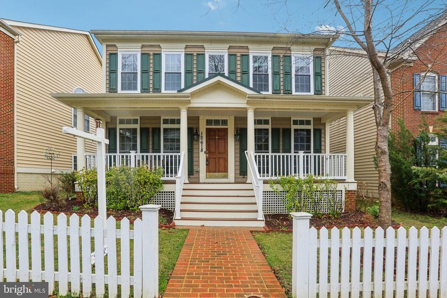 Welcome to 12618 Blue Sky Drive in the heart of Clarksburg Village. Offering approximately 2,800 square feet above grade and 4,264 total finished square feet, this 2008-built single-family home delivers space, functionality, and community lifestyle in one of northern Montgomery County’s most established planned neighborhoods.

This is a Certified Pre-Owned Home, meaning it has been pre-inspected for buyer confidence and includes a one-year home warranty provided by the seller.

The inviting full-length front porch sets the tone and provides a welcoming space to relax and connect with neighbors. Inside, a two-story foyer with ceramic tile flooring opens to formal living and dining rooms, both featuring hardwood floors. Hardwood continues throughout the main level and all four upper-level bedrooms, a feature buyers consistently prioritize.

The rear of the home offers a comfortable family room with hardwood floors and a gas fireplace, flowing into the kitchen and morning room. The kitchen includes wood cabinetry, granite countertops, gas range, side-by-side refrigerator, dishwasher, pantry cabinet, and ceramic tile flooring that extends into the bright morning room. From here, step out to the rear patio and detached two-car garage.

The main level also includes a half bath and laundry room.

Upstairs, you’ll find four generously sized bedrooms, each with hardwood flooring and ceiling fans. The hall bath has been updated with ceramic tile finishes. The spacious primary suite offers dual closets and a private bath featuring a double vanity, soaking tub, separate shower, vaulted ceiling, and recessed lighting. Upper-level windows have been replaced.

The fully finished lower level expands the home’s flexibility with a large recreation area, full bathroom, and egress window. The basement is in-ground and not a walkout. Carpets have been professionally cleaned and fresh paint is being completed in preparation for market.

Situated on a 5,006 square foot lot and part of the Clarksburg Village HOA, residents enjoy access to community pools, clubhouse, fitness center, trails, tot lots, and open green space. Conveniently located near Clarksburg Premium Outlets, Harris Teeter-anchored shopping, dining options, and I-270 commuter routes.

If you’ve been searching for a four-bedroom home with hardwood floors on the main and upper levels, finished basement space, detached garage, and added buyer protection through a pre-inspection and home warranty, this is one to see.