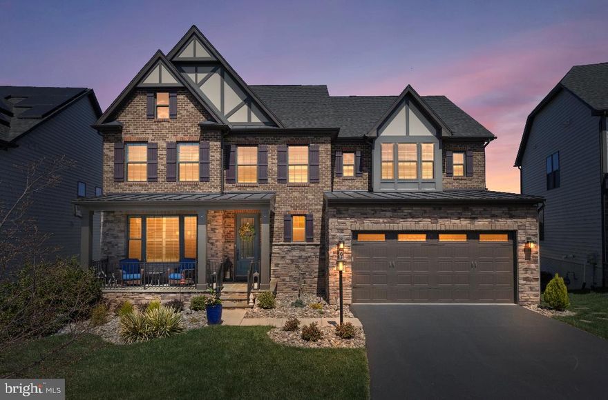 Stunning Craftsman Retreat in Sought-After Lake Linganore/Oakdale

Welcome to this exquisite Craftsman-style home nestled in the highly desirable community of Lake Linganore/Oakdale. Built in 2019 and offering 3,606 square feet of thoughtfully designed above-grade living space, this residence is the perfect blend of elegance, functionality, and modern charm.

Step inside to a breathtaking open floor plan accented by rich, 5-inch wide espresso-engineered hardwood floors that flow throughout the main level, upper level hallway and master bedroom. The heart of the home is a custom chef’s kitchen, beautifully appointed with crisp white Craftsman-style cabinetry, upgraded quartz countertops, a striking custom backsplash, GE Profile stainless steel appliances including double wall ovens, a gas cooktop, an oversized island with seating and a walk-in panty—perfect for both entertaining and everyday living. The main level also includes decorative french doors that separate a dedicated home office/den space with serene views of the wooded surroundings in the back of the home. The living room centers around a beautifully-framed gas fireplace adding elegance to the open space.

Natural light pours into every room with 9-foot ceilings, highlighting the luxurious designer paint tones that tie each space together in effortless harmony. The expansive living and dining areas flow seamlessly, making this home feel as comfortable as it is stylish.

Upstairs, you’ll find 4 generously sized bedrooms—each with a walk-in closet and 3 elegantly appointed adjoining bathrooms—enhanced by upgraded solid wooden interior doors in each bedroom, the laundry room, and utility room to help eliminate noise and ensure comfort and privacy for all. The fully finished lower level is ON-GRADE, offering a full bathroom, an oversized storage area and a SPRAWLING additional living space ideal for a media or recreation room, along with room for a second potential office area. As a bonus, an unfinished flex space offers the opportunity to create a LEGAL FIFTH BEDROOM—just add a window, drywall, and carpet.

The outdoor amenities are just as impressive. This home is perfectly positioned on a premium lot backing to private woods, offering both tranquility and privacy. Whether you're soaking up the sun on the custom lower-level patio or enjoying the beautiful sunsets from the covered upper-level porch, the outdoor living spaces are sure to become your personal sanctuary.

Don’t miss your chance to own this exceptional home in one of Frederick County’s most sought-after communities, with access to top-rated schools, scenic trails, lakes, pools, multiple tot lots, tennis-pickleball courts, an outdoor concert venue and everything Lake Linganore living has to offer.