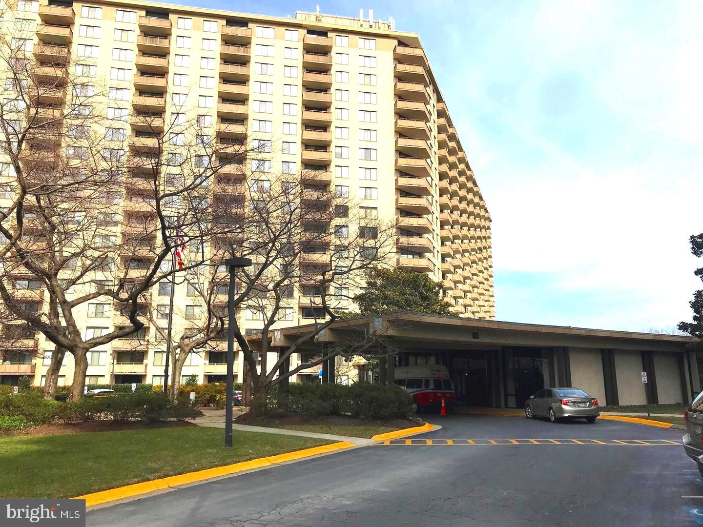 Beautiful, rarely available corner unit with extra windows , and a large balcony with gorgeous views. 25% Beautiful corner unit, larger than standard units with extra windows. Breathtaking view from large balcony. Large eat in kitchen with lovely maple cabinets. Oversize den/office. Updated bathroom with granite counter top. Gleaming hardwood flooring through out. High security building with 24 hour guard gate and front desk Concierge. The building has it's own Beauty Parlor, Grocery store/Deli, gourmet Italian Restaurant, Travel Agency, Dry Cleaners, and more. Activities abound, like tennis, pickle ball, swimming/hot tub, ping pong, movie night, trivia night, open mic nite, exercise classes, New Years eve party, book club, canasta, bridge, mahjong and much more. Secure indoor parking, electric car charging station, car washing station, and plenty of guest parking. Beautiful grounds for walking. Near Metro , I-495 Beltway, busses, shopping and restaurants. All utilities and maintenance included. One garage space included. Plenty of extra parking in parking lot. No dogs allowed.