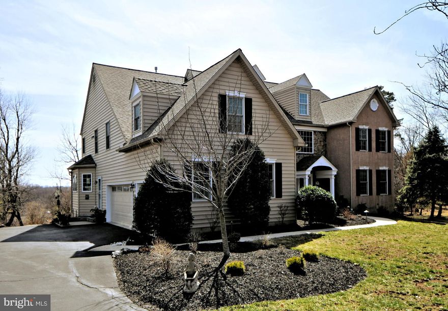Welcome to this captivating 5 br, 4 1/2 ba  jewel in Cedar Hill Woods.
Situated on a private cul-de-sac, this masterpiece of design and craftsmanship has a multitude of upgrades that are beyond impressive.  The grand entrance is breathtaking with a three-story atrium and views of the dining room, kitchen, butler’s pantry, morning room, library and living room enhanced with Kempas hardwood floors which are gleaming and beautiful. Hardwood floors are throughout the first floor and the second-floor hallway as well. Custom shelving and cabinetry in library make for an elegant work area.  Kitchen is adorned with 42” cherry cabinets, Silestone countertops, warming drawer,  and GE Profile appliances including convection ovens.  Marble fireplaces in both the family room and living room will embrace you with warmth and comfort.  9’ ceilings prevail throughout with 3 zone heat. Primary bath is exquisitely renovated and the master bedroom suite is expansive in size with an office/dressing room and two walk-in closets.  Additional bedrooms on the second floor include an en-suite bathroom in the second bedroom and a “Jack and Jill” bathroom between the third and fourth bedroom. 
 Third floor is ideal for a nanny or in-laws and the ultimate in privacy with a bedroom and full bath and a media room on the opposite side of the floor.  Other stellar features include:  instant hot water, holiday lights in front windows, whole house stereo in office, family room, kitchen and primary bed and bath. Main bedroom has his/hers “California Closets”.   Finished walk-out basement with great sunlight and powder room. Deck features motorized retractable awning. New roof (2022) and hot water heater (2025), landscape lighting, slate patio and new deck door. Storm and screen doors.  Abundant Custom shelving in garage for convenient storage.
The back decks overlook a delightful Koi pond designed and built with love. This habitat is home to approximately 13 Koi fish. They hail by different names  depending on who is feeding them. They have been a part of the property for 18 years. The Koi provide beauty serenity and fun seven months of the year! They hibernate from the end of fall to beginning of spring. The beautiful foliage around the pond protect them and enhance the habitat.
A beautiful pond with mature koi complements the landscaping. The cul-de-sac is surrounded by beautiful trails that wind their way a mile behind the development. The property is a bird watchers delight.  Neighborhood runners and walkers enjoy spotting the magnificent blue heron that frequents a nearby protected wildlife habitat.  920 Red Stone Lane is minutes to the Ambler Y, Whole Foods, 309 Cinema, shopping and all major arteries.