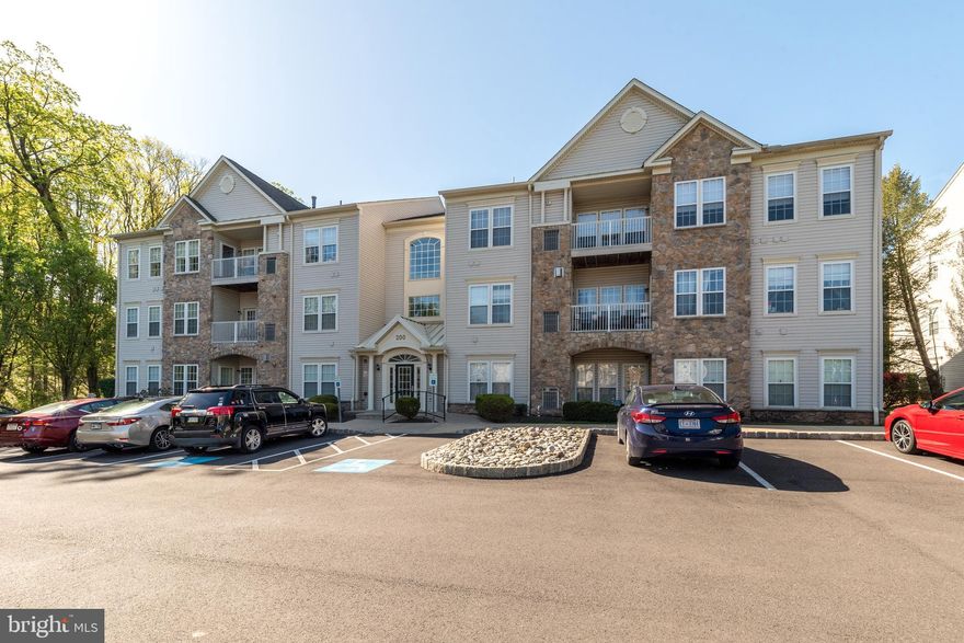 Welcome to one of the most serene spots in Forest Ridge! This beautifully maintained 2-bedroom, 2-bath condo is located on the second floor and offers gorgeous green space views from every window. Situated in the highly sought-after 55+ community, this home combines comfort, convenience, and a truly peaceful lifestyle.

Inside, you’ll find a light-filled open floor plan with a spacious living room featuring a gas fireplace. The adjacent dining area and den/office space flow seamlessly into the living area and offer tranquil views of the balcony overlooking wooded and open green space. The large kitchen provides plenty of cabinetry and workspace and includes a space-saving laundry area for convenience. Recent updates include a new HVAC system and water heater both installed in 2019, ensuring comfort and peace of mind. The primary suite is generously sized with abundant natural light, a walk-in closet, an additional mirrored closet, and a private en suite bath. The guest bedroom is located on the opposite side of the home for added privacy and is accessible to the second full bath.

This second-floor unit is easily accessible via elevator or stairs, and the building features a shared reading nook for residents to relax. A community clubhouse is also available for gatherings and events. Enjoy maintenance-free living in a lovely community just minutes from shopping, dining, and everyday conveniences.