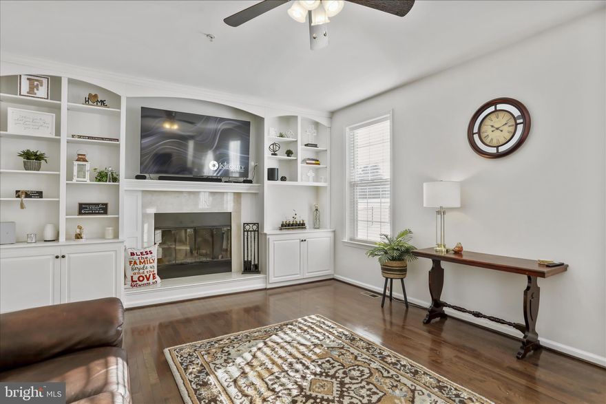 Welcome home!  A covered front porch and beautifully fenced yard sets the tone as you arrive to this carefully  maintained home!  Inside, you'll be greeted by gleaming hardwood floors and an open 2- story entryway. The main level offers a bright, semi- open layout with abundant natural light. The living room features a wood-burning fireplace w/ marble surround and built in book cases on either side. The updated kitchen offers an  island, granite countertops, and stainless steel appliances.  The main level also includes a large separate dining room and office!  Added conveniences include a half bath and main-level laundry.
Upstairs, the primary bedroom features a private en-suite bath w/ separate vanities. 
Additional highlights include custom blinds and storm door (2024/ 2025), solar panels (2025), dual water heaters,  and a professionally painted interior.  The  unfinished lower level has an oversized walk up to the rear yard.  Enjoy outdoor living on the large back patio overlooking a flat, expansive backyard—perfect for entertaining or relaxing!