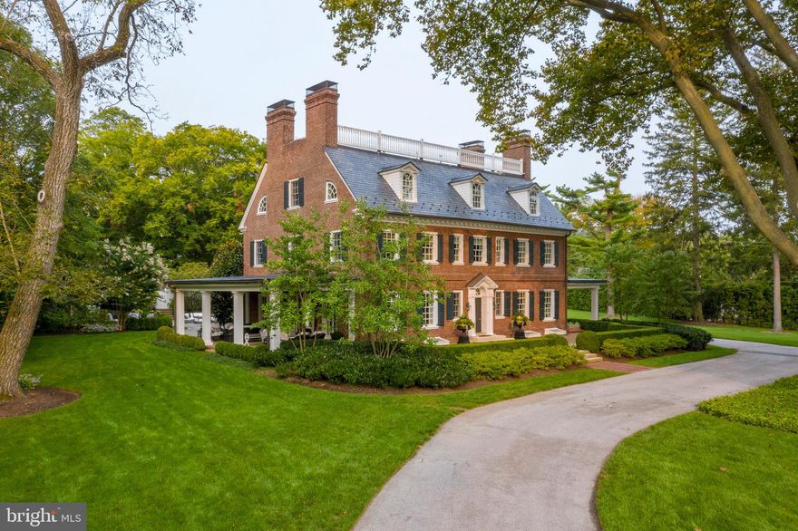 Town and Country living outside of Philadelphia. 375 N Spring Mill Rd is the perfect fusion of The Ultimate Location and the Ultimate in Luxury living. Current owners put in some fabulous upgrades, including but not limited to, all new HVAC systems,  tennis court fully resurfaced and painted with warranty, new downspout system for gutters, upgrades are all listed in document section, see attached for the entire list. Located in the prestigious estate section of Villanova on Spring Mill Road, this gated oasis is situated in the very heart of Philadelphia's coveted Main Line. The property features over 2.5 flat and meticulously landscaped acres, a newly refinished tennis court, mature old growth trees, and a spectacular antique brick herringbone entrance patio. Seamlessly blending old with new, the crown jewel of the outdoor space is the dramatic addition of a 1700 sq foot flagstone patio, complete with a 15 foot outdoor stone fireplace with hearthside seating, and built in grill. This stunning Georgian home offers the ultimate in lifestyle living. The tall, perfectly manicured rows of Arborvitae trees lining the property give the feeling of a hidden private enclave within, yet just outside its perimeter is immediate access to all that the Main Line has to offer. The property can be accessed easily from 2 driveways - the gated front entry off of Montgomery Avenue or the quiet private lane behind the house, off of Spring Mill Road. The prominent location is only nine miles from Philadelphia, and walkable to the Villanova train station, and so affords supreme convenience for traveling to Philadelphia or New York City and beyond. Originally part of the Walnut Hill estate, which still exists today, this property was divided into its own parcel in 1909. A historic plaque noting this date adorns the side of the home. With a gorgeous, stately entrance fronting Montgomery Avenue, the rear of the home offers a wonderful neighborhood feel. Down the small lane behind the house are eight other private homes for trick or treating or socializing. Just beyond the end of the lane is yet another family neighborhood with direct walking access to Villanova University, Bryn Mawr and more. Inside the home is updated to perfection, with large rooms that easily flow from one to the other. Each of the main level living spaces has French doors that open to covered porches and expansive terraces. The home underwent a comprehensive renovation in 2008, which upgraded everything: a new slate roof was added, along with copper gutters, all new windows, new updated electrical with 400 amp service, new plumbing, top of the line zoned heating and central air, and whole house generator (added in 2015). In 2021 and 2022 extensive renovations valuing almost $250,000 were made. (See attached documents for a full breakdown of upgrades and costs).  The state of the art technology and home automation system provides complete audio, lighting, and entertainment control for the truly modern experience. Old world workmanship and high ceilings blend seamlessly with the chic decor and modern kitchens and baths. The home has had continued upgrades and modernizations over the last 14 years,  so that it has the unique characteristics of a showplace inside and out, but also offers the comforts of a family home. Though this home is stately, when you walk in you immediately feel the cozy, casual, and very hip vibe. (See attached fact sheet on rooms for more specific information)