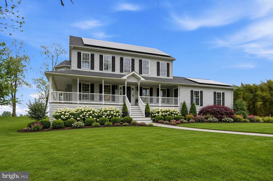 Perched on a hill and backing to beautiful countryside views, this grand colonial offers over 4,300 finished square feet on 1.3 private acres, complete with a welcoming wraparound porch perfect for relaxing and taking in the scenery. Freshly painted throughout, the home features 5 spacious bedrooms and 4 full baths, including a main-level bedroom perfect for guests or multi-generational living.

Inside, you’ll find an open floor plan with hardwood floors throughout, a gas fireplace, breakfast nook, and a gourmet kitchen with a large center island designed for both everyday living and entertaining. The oversized primary suite includes a private balcony overlooking the property.

Additional highlights include a fully finished rec room, oversized 2-car garage, a newly installed driveway, owned solar panels (not leased), and a tankless water heater for added efficiency and convenience.

--