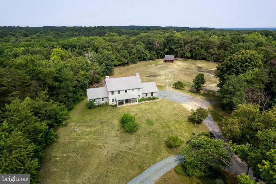 Amazing farmette in Elk Neck on over 9 acres ready for you to bring your horses. Long private driveway leads to this beautiful, move in ready 5 bedroom, 2.5 home. Main level offers a first floor owners suite with hardwood flooring, vaulted ceilings, updated bath with custom tile shower with glass door and dual vanity, new kitchen with LVP flooring, white cabinets, granite counters, new appliances including glass cooktop with pot filler and pantry with slide out drawers, separate family room and dining  room and family room with gas fireplace and built in shelving.. Mud/laundry room leads to two car garage. The large two-tiered deck offers amazing views of pastures and pond and offers great entertaining space. The upper level offers four spacious bedrooms and updated hall bath. Partially finished basement with bonus room that offers a window and door with direct access to rear yard.  Approx 3+ acre paddock with new fencing plus, three stall barn with feed and tractor room, hayloft and chicken coop. Barn offers water and electric. Additional building offers great storage space for tools and equipment. Other features include hardwood floors, custom trim and molding. One-year warranty included. Property next to this home will also be available for sale soon and is owned by same family.