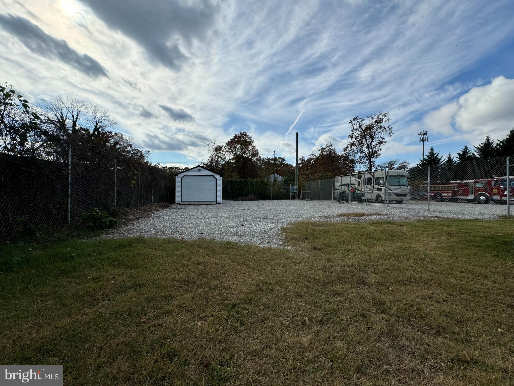 This is a lot lease listing for an approximate 60'x60' fenced lot, rent includes security footage, includes electric and a storage shed/garage unit. Easy access off Waterford and B&A BLVD. RV's, boats and heavy equipment friendly. Additional lots - information available upon request.