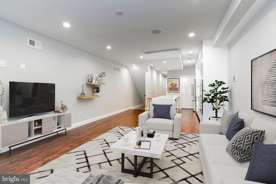 Get ready to be wowed by this stunning 3-bedroom, 3 full bathroom condominium previously featured in Philly Magazine and part of a luxury condo community.  Ultra-luxurious, high-end new construction, with a huge backyard outdoor space.  Approximately 5 years remaining on the tax abatement.  You are 100% abated on the building/property assessment and only pays taxes on the land assessment (approximately $1,000 for the year!!!!).  The first floor features an incredibly modern yet elegant kitchen with seamless, soft-closing white cabinets and waterfall quartz countertops. The kitchen is equipped with a walk-in pantry and Jenn-Air Luxury Appliances like an in-wall double oven, cooktop stove and range hood, wine fridge, and dishwasher. Oversized living room area and the first floor also features a spacious bedroom, a beautifully modern full bathroom with LED-lit mirrors, built-in state of the art surround sound speakers, and a massive backyard for all your favorite outdoor entertainment activities. The lower floor features another spacious bedroom with an ensuite modern bathroom with LED lit mirrors.  In-unit washer/dryer on this level. The gorgeous master suite features a generous walk-in closet with a custom-built organizer, a huge bathroom with two shower heads, a separate deep soaking tub, a double vanity sink and LED-lit mirrors.  In addition to big closet spaces in all the bedrooms, there are additional closet spaces throughout the condo. This unit incorporates various smart home features and extras like: smart NEST thermostat, a touch screen iPad mounted to the wall for a smart home technology hub, video display and doorbell buzz in system, key fob entry access and more.  Commuters' paradise with a transit score of 81 and very walkable to coffee shops, restaurants, gyms, supermarkets and the bustling Fairmount Ave commercial corridor.   What a state-of-the-art masterpiece, schedule your exclusive showing to see for yourself and make it yours.  BUYER responsible to confirm tax abatement and assessments with tax authority.