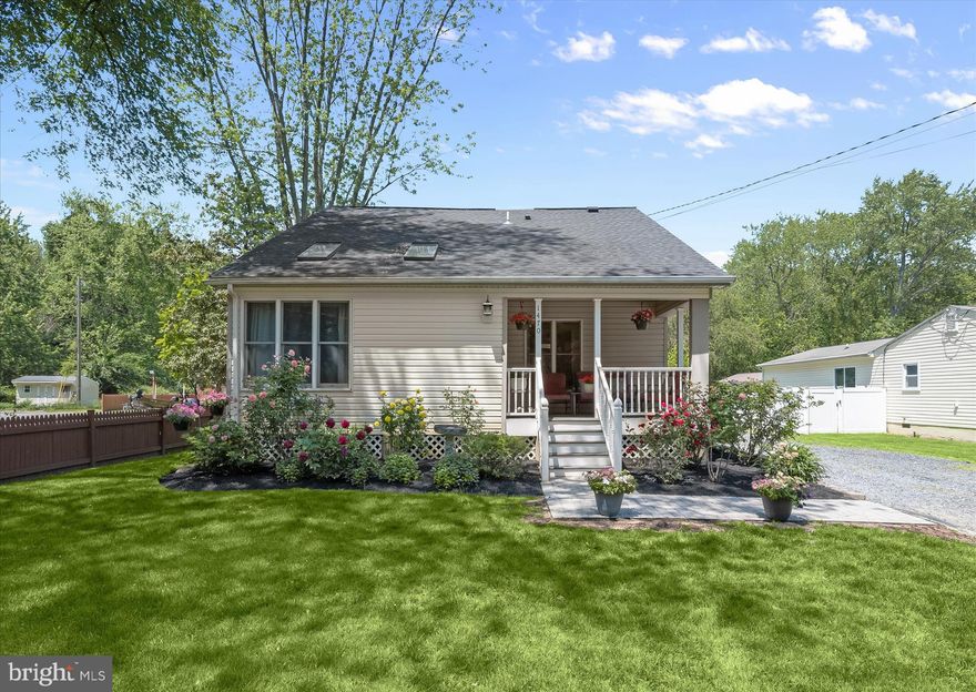 Beautifully updated and filled with thoughtful improvements, this Cape Cod in Annapolis combines model-like interiors, a recently finished lower level, and inviting outdoor living just minutes from the Chesapeake Bay. Blooming perennial landscaping and a covered front porch create a warm welcome, while inside, a deceptively spacious open concept floor plan showcases hardwood flooring, recessed lighting, and a soft neutral palette that carries throughout the home.
The living room is bright and airy, highlighted by a partial vaulted ceiling accented with skylights that fill the space with natural light. Just beyond, the renovated kitchen blends style and function with stainless steel appliances, a tile backsplash, abundant cabinetry, roll-out shelving, and a swing-out pantry designed for effortless organization. A dedicated dining area with a modern light fixture completes the main living space with a polished touch.
The main level includes a spacious bedroom with a walk-in closet featuring a built-in organization system. Also on this level is a beautifully renovated full bath complete with a double sink vanity, stylish finishes, and a tiled tub and shower surround. Nearby, the laundry room provides storage shelving and convenient access to the backyard.
Upstairs, two generously sized bedrooms share an updated full bath with a tiled shower enclosed by frameless glass. One of the upper level bedrooms is enhanced by a charming shiplap accent wall and a cozy window seat, adding character and a tucked-away place to relax. The recently finished lower level expands the living space with a comfortable family room featuring durable wood-look tile flooring, a versatile bonus room, and a sizable storage area.
Outdoor spaces are equally inviting, with a deck and patio overlooking the spacious backyard, creating room to entertain, relax, or enjoy the surrounding greenery. A storage shed with a garage door adds functionality, while major updates including the roof and water heater offer additional peace of mind.
This location places you moments from some of Annapolis’ most scenic waterfront recreation, including Sandy Point State Park with its sandy beach, marina, fishing and crabbing access, and sweeping Chesapeake Bay Bridge views. Jonas Green Park, Quiet Waters Park, and Thomas Point Park are also nearby, offering trails, kayaking, waterfront overlooks, and endless opportunities to enjoy the natural beauty of the Annapolis area.