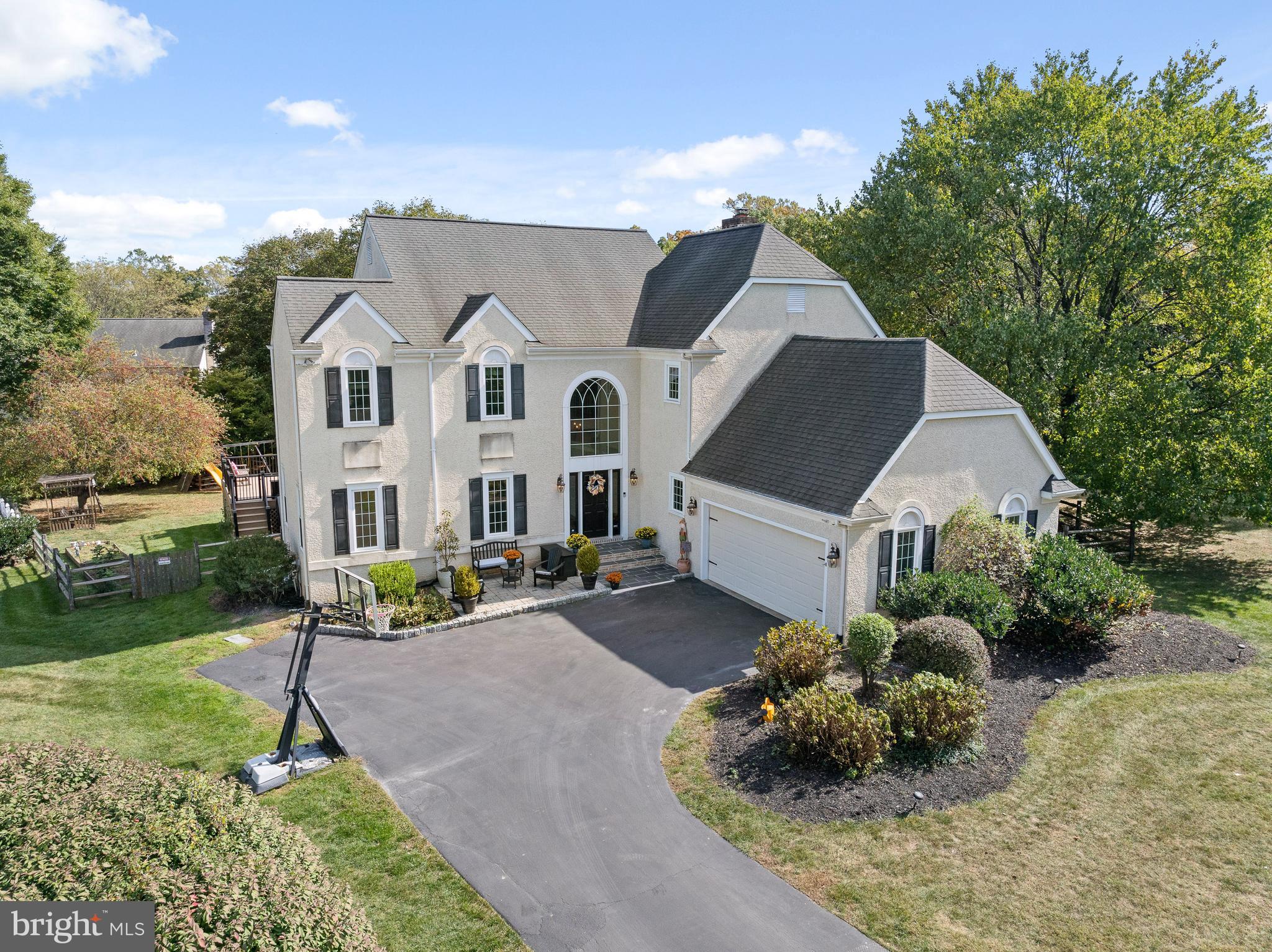 Welcome to 7 Fieldstone Lane, a stunning residence nestled at the top of a peaceful cul-de-sac in Bryn Mawr, offering the perfect blend of modern luxury, convenience, and tranquility. This thoughtfully enhanced 5-bedroom, 4.1-bathroom home is a rare gem in one of the most desirable neighborhoods just minutes from shopping, dining, and prestigious schools.
As you enter, the grand two-story foyer sets the tone for the scale of this luxurious residence. Natural light warms the main floor, punctuated with Mercier Maple hardwood flooring throughout. An inviting family room, brightened by windows on two exposures and featuring a wood-burning fireplace accented by a wall of custom marble, flows effortlessly into the heart of the house - an expansive gourmet kitchen, equipped with high-end Miele appliances, including a plumbed coffee maker, two ovens, two dishwashers, and four refrigeration options. A coffee bar, informal dining area, and a newly established pantry provide daily comfort and convenience. The custom Omega cabinetry, marble brick back splash, quartzite countertops, and ample natural light make this space a true culinary haven, ideal for both intimate family gatherings and grand entertaining. The kitchen also features two entryways onto the newly built Trex-style deck with a PDC Synergy Swim Spa, providing the perfect space for relaxation and fitness while contributing to the home's healthy lifestyle appeal. A large, private yard with a swing set and garden seating area, offers an ideal backdrop for entertaining or peaceful reflection. An elegant dining room, spacious laundry, and two office spaces complete the spectacular main level.
Upstairs, an open landing with brilliant hardwood sets the stage for four spacious bedrooms. The luxurious primary suite boasts an upgraded spa-like bath with freestanding tub, custom vanity, tiled shower with pebble flooring, and expanded closet space - a serene owners retreat. Two additional bedrooms share an upgraded hall bathroom with new vanity, while a fourth bedroom with en-suite bathroom finishes the second level.
The expansive basement is a versatile haven for relaxation and recreation. Whether you’re enjoying a movie in the TV area with elevated platform seating, challenging friends to a game of ping-pong or air hockey, or getting in a workout, this space is designed for both fun and functionality. The convenience of a full bath, separate exercise room or bedroom, and kitchenette make it a perfect extension of the home’s living area, ideal for hosting guests or indulging in some downtime.
Every detail in this home has been thoughtfully designed and meticulously maintained, from upgraded lighting and electrical systems to an advanced security system, ensuring peace of mind. Located just 5 to 10 minutes from everything you need, this home offers the best of suburban living while being within easy reach of the vibrant culture of Philadelphia. Whether you're drawn to the elegant design, the unparalleled convenience, or the serene surroundings, 7 Fieldstone Lane is ready to welcome you home.