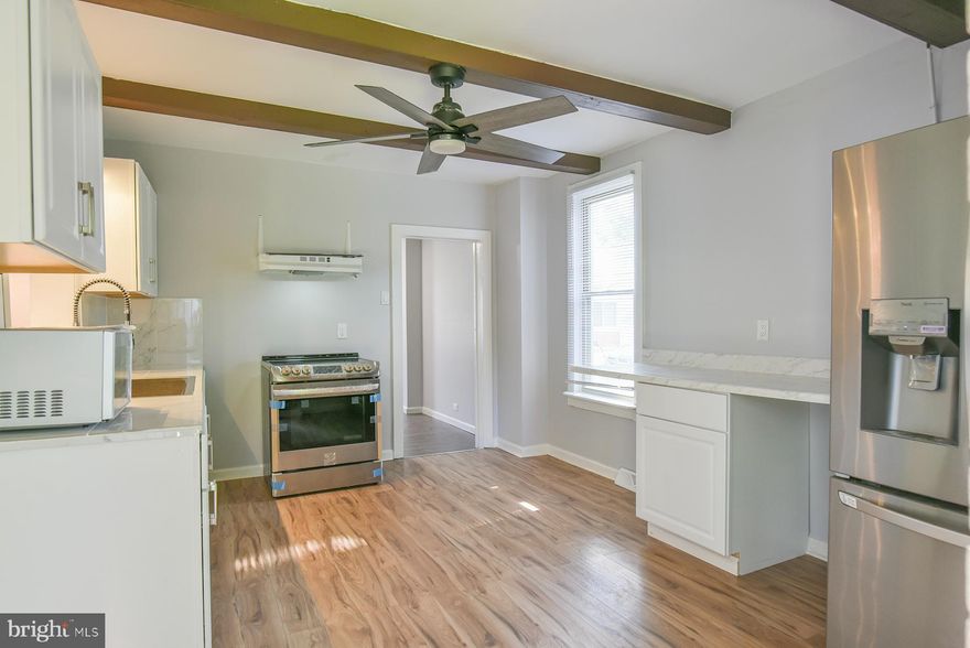 ** The City of Hagerstown is offering $7,500 to qualified buyers towards closing costs, via the Homeownership Program**  Don't miss this beautifully renovated home offering comfort, style, and space! A brand new central air conditioning and heating system has just been installed, providing year-round energy-efficient comfort. This spacious home features three finished levels, including a fully finished attic!  Step inside to find all-new flooring, fresh interior paint, updated fixtures, and a renovated full bathroom with modern finishes. The home is filled with natural light thanks to replacement windows throughout. Enjoy multiple living areas, including a welcoming family room, a formal living room, and a separate dining room ideal for entertaining. The completely updated kitchen features stylish stainless steel deep sink, stove, range hood, refrigerator. The  unfinished cellar style basement makes for good additional storage.  Outside, you'll find a massive backyard, offering endless possibilities for gardening, outdoor entertaining, or future expansion. Conveniently located near shopping, schools, and commuter routes. Don't miss your chance to own this move-in ready home with major updates already done—schedule your tour today!