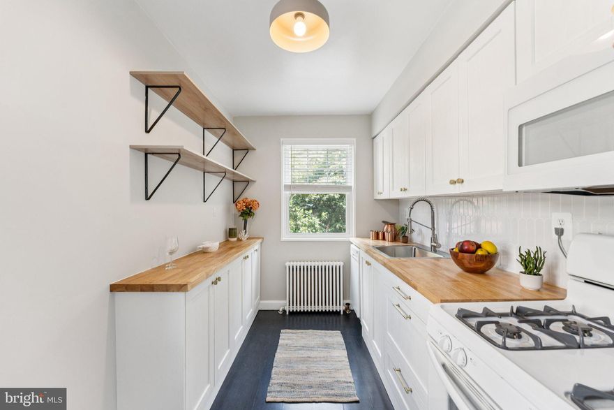 Unit number on the door is 4. This totally remodeled 1 bedroom 1 bath condo is just what you've been looking for -- stylish with brand new LVP flooring, fabulous kitchen, all new bath -- and what a location! Easy access to GW Parkway and I66, a mile to Rosslyn metro station, and all the shopping, dining and entertainment Rosslyn has to offer just minutes away. This unit has been freshly painted, and every room has a window for great natural light.  The kitchen features new cabinets, new butcher block counters, and brand new microwave.  Full bathroom was remodeled down to the studs, with new tile, all new fixtures, vanity and toilet. You're tucked away near the Netherlands Carillon and Iwo Jima Memorial, and only minutes from Washington DC. Don't let this one get away -- it's a winner.

Condo fee includes ALL utilities. Storage locker in the basement.