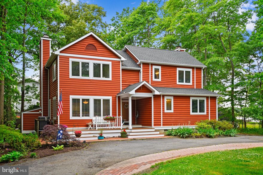 Offers due Monday June 7, at 8 PM. Enjoy tranquil year-round water views of Fishing Creek just off of the Chesapeake Bay in this 4-bedroom 3 bath home in amenity-rich Arundel on the Bay! Waterfront without the trouble and cost! This immaculate and bright custom-built contemporary sits on an extra-large corner lot (.34 acres) with lovely mature trees sweeping across the back and front yards and expansive decking on two levels to enjoy sunsets at the day's end! The large and private yard with beautiful and professional landscaping makes this a must-have oasis!    The main level features recently refinished hardwood floors throughout, two dining areas and a living room to entertain friends as well as a cozy family room that extends off of the updated kitchen.  There are two fireplaces on the main level, one in the family room and one in the living room with wide water views from both! You’ll have to choose which is your favorite-- and claim it!   Cooking is a joy in the updated kitchen with classy and neutral granite countertops, bright white cabinets and stainless-steel appliances and did I mention the water views from the kitchen window? A first-floor bedroom with view and full updated bathroom may be used as a guest space, home office or an optional Primary Bedroom. With so many working from home, this could be your office and exercise room! Put in a pull-out couch and you’ll have working from home perfection- just don’t tell the boss!    The fabulous views continue on the second floor.  The primary bedroom has a large walk-in closet and spa-like primary bathroom with a great white soaking tub, huge walk in shower, heated floors, and of course a granite double vanity!The two additional second floor bedrooms are oversized, and one leads to an upper floor deck, just another spot to enjoy the view! There is an additional updated bathroom and upper floor laundry as well! Two outdoor sheds for storing your kayaks and yard equipment as well as extensive crawlspace for extra storage.  On top of all this, you will be waking up in a water-privileged community that offers a large and recently updated community beach, a convenient boat ramp and a long pier with boat slips for power or sail, kayak and canoe and basketball court, large tot lot/playground, as well as grilling and picnic areas directly on the Chesapeake Bay! It’s a warm and dog-friendly place to be and there are many community events throughout the year. Community meet-up dinners at the beach, cocktail gatherings, and of course Santa’s arrival and an amazing July 4 picnic event! You’ll never want to leave. Make your family and friends come to your nearly water-front home-- this time! Don’t miss out on this truly unique house – in this market it won’t last long!