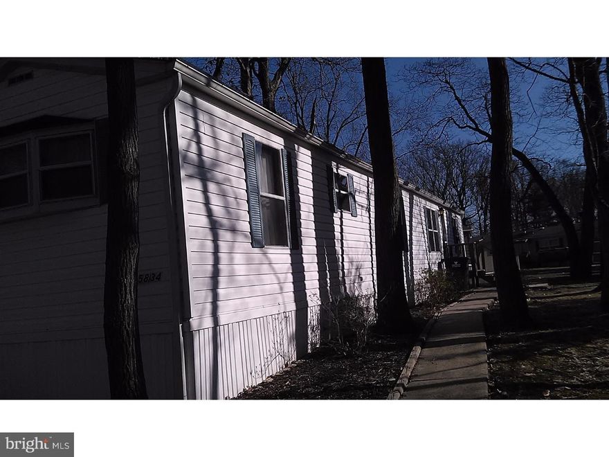 Enjoy this beautiful community in this 2 bedroom 1.5 bath immaculately kept mobile home.  This beautifully maintained park features well maintained properties creating a beautiful country setting in this well established park yet you are moments from the major roadways.  New carpeting throughout, laminate flooring in the bathroom and entrance.  Master Bedroom is spacious, open kitchen is large & set for entertaining.  2nd Bedroom has built in office shelving that would make an amazing den area!  Many upgrades washer and dryer included.  Refrigerator available, storage shed and many other amenities through the Community.  Storage Shed on the premises is included in this sale and has electric available.  Owner is pricing to sell.  To schedule a showing Kelly Logan for an appointment to see this little treasure!
