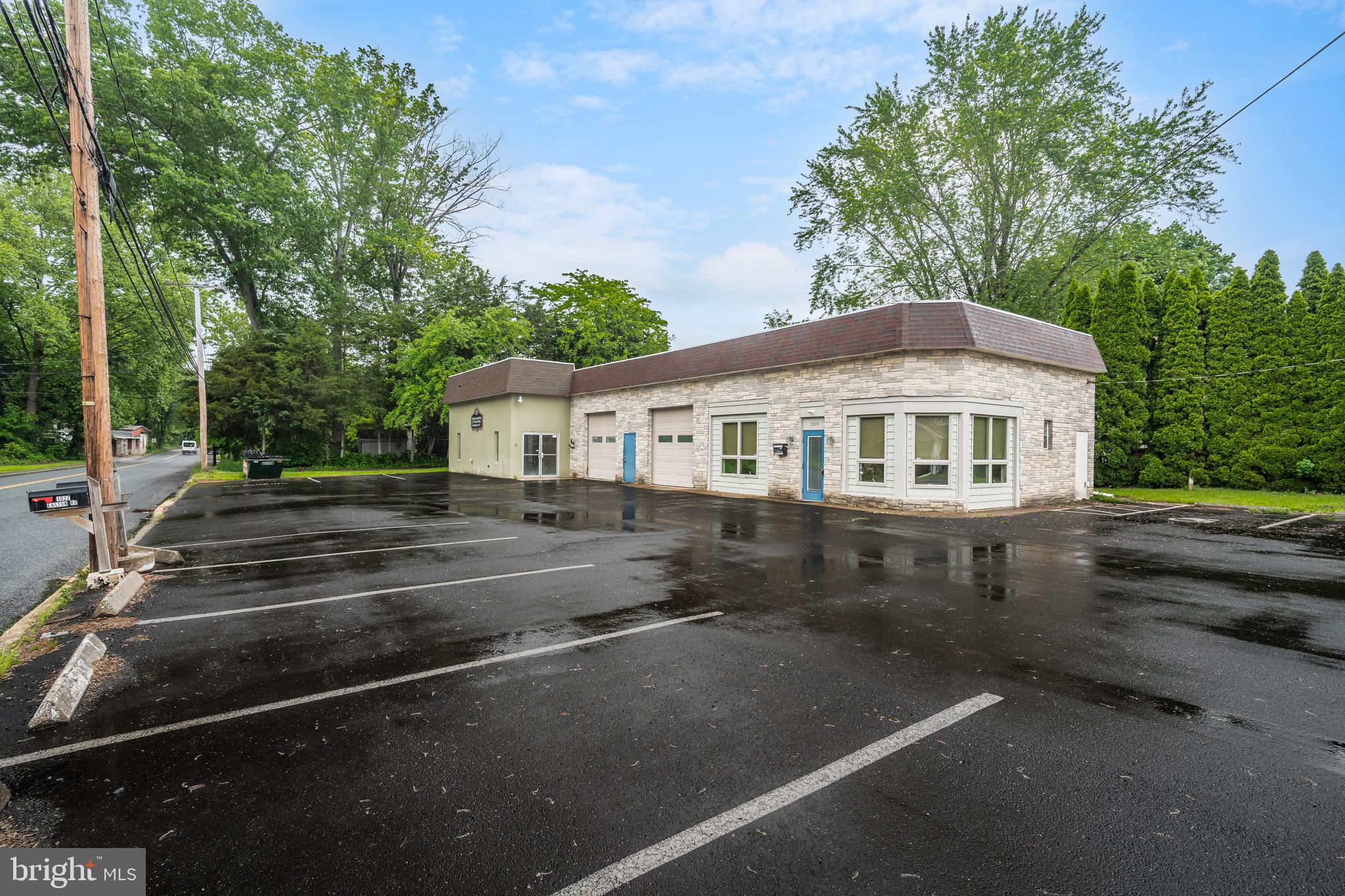 Stunning warehouse/garage space offering over 3,000 sq ft with multiple offices and a storefront now available on Route 611 in Riegelsville. Conveniently located within 20 minutes of Route 78, Route 22, and the New Jersey border. Features include 16-foot ceilings, two open-bay garage doors, a freshly paved 14-space parking lot, a kitchenette, and a bathroom. This well-maintained property allows for a variety of uses including auto service, retail, building trades, warehouse, gift shops, and more. A rare opportunity with endless potential!