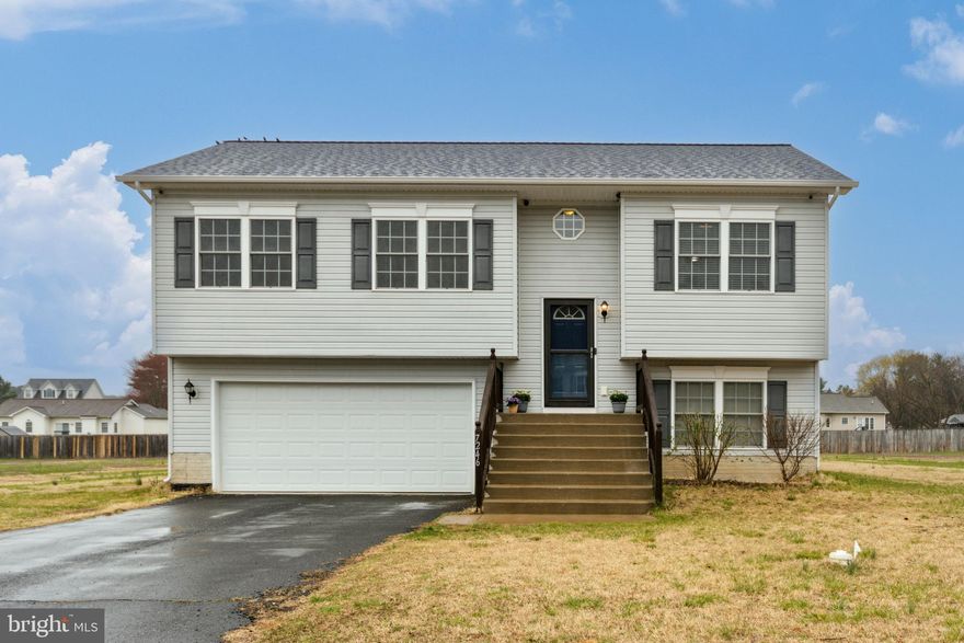 Discover this beautifully maintained home in the heart of Port Royal, VA, convenient to Dahlgren, Fort Walker, AP Hill and only 15 minutes to the Spotsylvania VRE and 20 minutes to Cosner's Corner. This sun filled home provides over 1400  sq ft. of living area and move-in ready. Freshly painted interior features a great room with gas firplace creating a warm and inviting atmosphere, an eat-in kitchen with spacious center island  ideal for gatherings and meal prep plus an eat-in area with access to the rear deck. The Primary Bedroom with a full ensuite bath is sure to please and two additional bedrooms with a full bath finish the main level. The lower level boast a versatile media room with an additional den, perfect for a home office or guest space (potential 4th BR not to code) and half bath. Situated on an almost half-acre lot, this home also includes a spacious two-car garage and additional shed for storage. Recent updates include HVAC, refrigerator and dishwasher and engineered wood floor. Don’t miss out on this opportunity to own a lovely home offering the perfect blend of comfort and style.