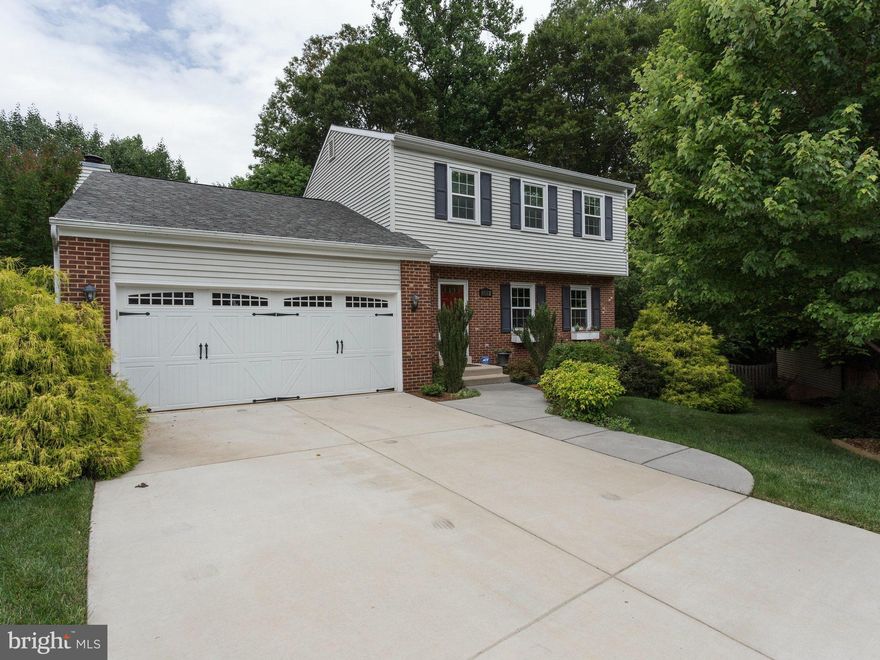 WOW!! Charming 3 level colonial w/2car gar has been immaculately kept! $60,000 in upgrades including; renovated kitchen, new privacyfence, triple pain argon windows, renovated upstairs bathroom, 9 inches of R30 attic insulation, new sliding glass doors, & beautiful extensive landscaping! Lovely private deck and a walkout basement, all resting in a cul de sac! Stop by open house 1-4pm on 6/28!