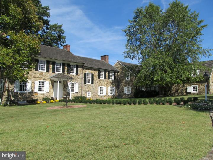 Springhead Farm originating from a 1703 William Penn land grant, is a spectacular 62 acre property and elegant manor house dating back to the early 1800's. It is truly a one-of-a-kind estate property that most recently was the personal residence of renowned Philadelphia architect, Vincent Kling. A long sweeping, tree lined, entrance driveway leads to a courtyard entry to this magnificent stone manor house. The main house shows beautifully and features incredible original period details including: deep window sills, cut nail hardwood flooring, beautiful wainscoting and finish trim details, eight fireplaces, and outstanding views of the surrounding countryside. More recent additions include a fabulous family room with custom paneling, a large central fireplace, and a wall of windows with views and access to the garden area. A flexible floor plan on the 2nd floor allows for 5 or 6 bedrooms and includes 5 full baths. The main house even features the more recent addition of an elevator. There are numerous original out buildings on the property, including a 4 bedroom stone tenant house, a smoke house, spring house, root cellar, corn crib, and two barns including an outstanding equestrian area with 6 stalls, a tack room, and a half bath. One of the barns contains a terrific party/event room also. Stone patios, terraces, an in-ground pool, and a gazebo complete the exterior. The surrounding hillsides, vistas and panoramic views are absolutely stunning and seem to go on forever. Don't miss this exceptional once in a lifetime opportunity to own a true piece of Chester County history! Property is in Act 319, under conservancy, and is not sub-dividable.
