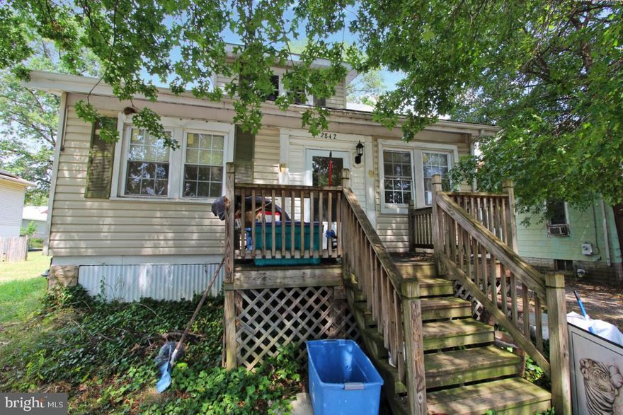 Come see this spacious home! It is currently set up as one large house with a separate living space, however, it can be divided into two individual living spaces. The smaller side would be a perfect family apartment, large master suite or in-law suite, with space for a bedroom, a living space, one full bath, a kitchen, and a laundry area. This house is already equipped with two water heaters, two air conditioning units, and two separate entryways. The larger side has a spacious living and dining room, a beautiful foyer with a sitting room, a full kitchen, one full and one half baths, and three ample bedrooms. The basement has vast space for storage, with an affixed divider to optimize organization. Boasting natural light, square footage, and two driveways, this may be the perfect home for your rental portfolio or family, offering many options for customizing to your specific needs.