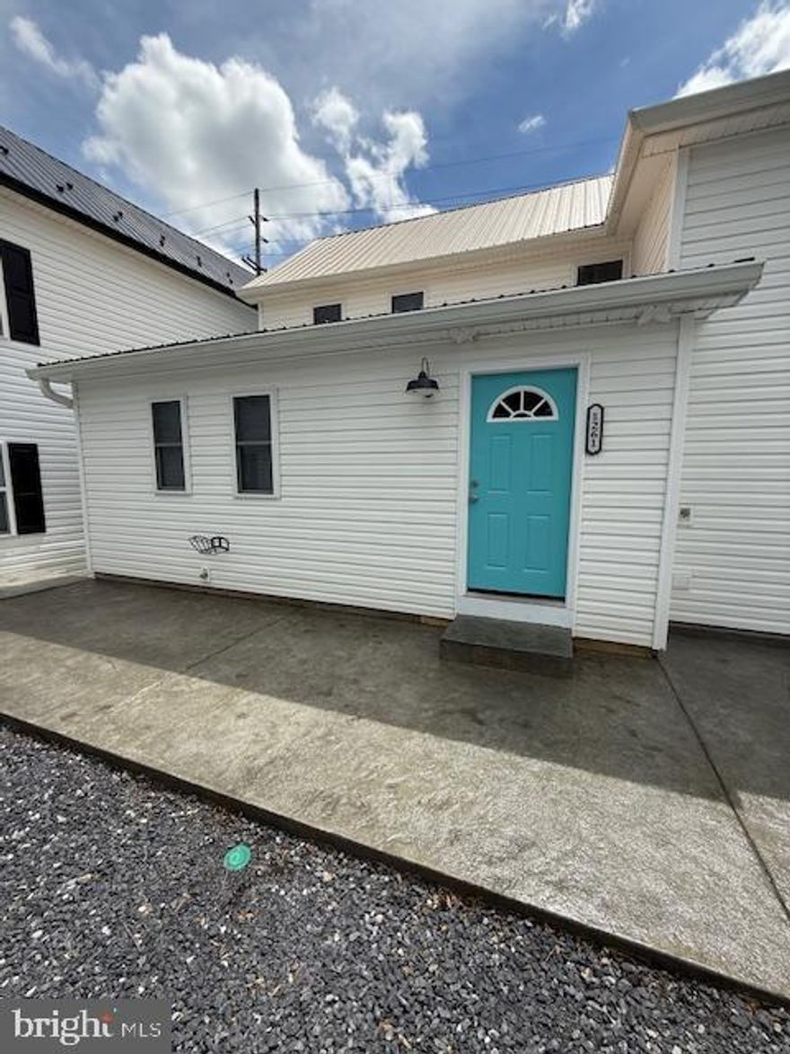 Welcome to your new home in the heart of the charming town of Hedgesville. This cozy and beautifully renovated 2 bedroom/ 1 bath duplex- features  granite countertops , new shaker cabinets, new appliances including a washer & dryer. All the flooring is new LVP, as well as Brand new Mini- split HVAC.
Hedgesville School district- Owner will consider pets on a case by case with additional fee and non-refundable deposit. Available immediately.