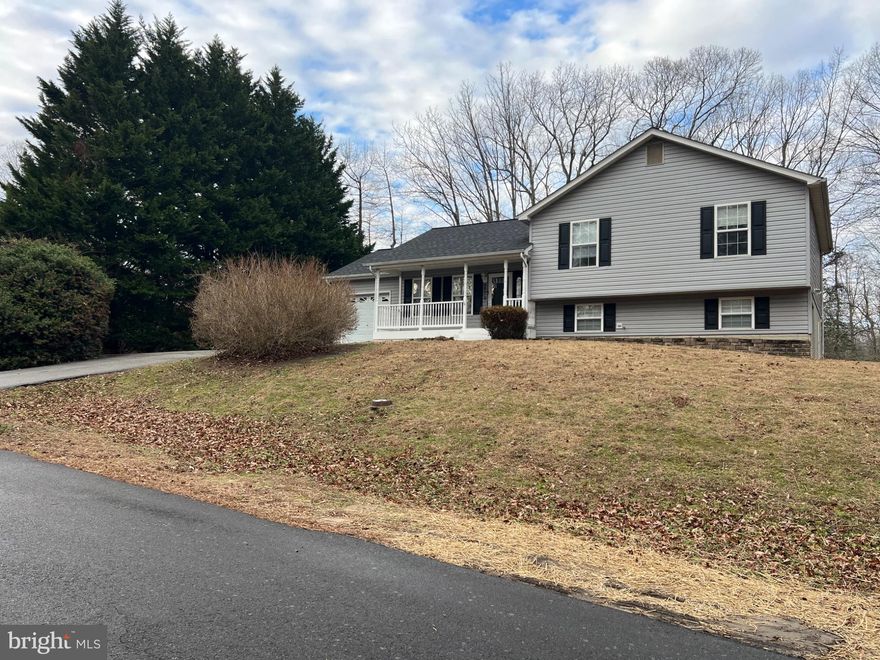 Nestled in the serene Chesapeake Heights, this charming split-level home offers a perfect blend of comfort and functionality. Built in 2000, this well-maintained residence boasts 2,002 square feet of thoughtfully designed living space, ideal for creating lasting memories. Step inside to discover four spacious bedrooms and two full bathrooms, providing ample room for relaxation and privacy. The fully finished basement adds versatility, perfect for a cozy family room, home office, or play area. The inviting layout encourages gatherings, while the natural light streaming through the windows creates a warm and welcoming atmosphere. The exterior features durable vinyl siding and a concrete foundation, ensuring longevity and low maintenance. Enjoy the expansive 0.78-acre lot, offering plenty of outdoor space for gardening, entertaining, or simply unwinding in nature. The attached garage provides convenient covered parking and additional storage, making everyday life a breeze. Located in a peaceful neighborhood, this home is just a short drive from local amenities, parks, and recreational opportunities. This property is not just a house; it's a place to call home. Experience the perfect balance of comfort, space, and community in Chesapeake Heights. Don't miss the chance to make this inviting residence your own!

Roof replaced 2023
New siding 2023
Outside HVAC Unit replaced 2015
Septic pumped 2023