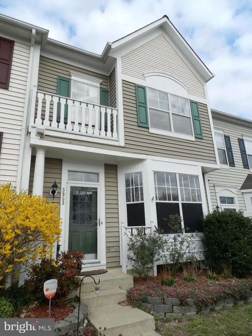 Super cute move in ready 4 level town home in sought after quiet Ridgeleigh. You'll be impressed by this beauty with it's precious curb appeal and brand spank'n new architectural style roof! The open floor plan is graced with golden real hardwood floors. The powder room is strategically located away from the kitchen and has been updated. The kitchen has plenty of table space, gorgeous granite counter-tops, black stainless steel refrigerator with complimentary gas cooking stove, microwave and dishwasher. There is a stunning mosaic tile back-splash and window over the sink. What you'll really love is the sizeable pantry, larger than in some single family homes! There are neutral custom made blinds with a remote control.  A new door leads to a completely re-built composite deck and it is BIG! The back yard is fenced and if the time of year is right you can catch a glimpse of the Occoquan reservoir. The master bedroom is huge and has vaulted ceilings and a set of stairs that leads to your private loft bathroom with a large soaking tub and dual vanities and private water closet. Two other bedrooms and an updated hall bath are also on this floor with it's brand new carpeting. The basement is a true walk out and is where you'll find a rec room and built in bookshelves and a cozy fireplace, the laundry is also down here and tons of storage. Also, a rough-in should you decided to build a full bath later. All of the Lake Ridge amenities are here for your use...tons of clubs, five swimming pools, lighted tennis courts, a boat ramp, spray-ground, basket ball courts, tot lots, the award winning Fantasy playground, and nearby Lake Ridge Marina where you can rent boats, fish, play golf and putt putt. All the shopping you need right around the corner.  Minutes away from the VRE and public transportation and the Virginia slug lines.