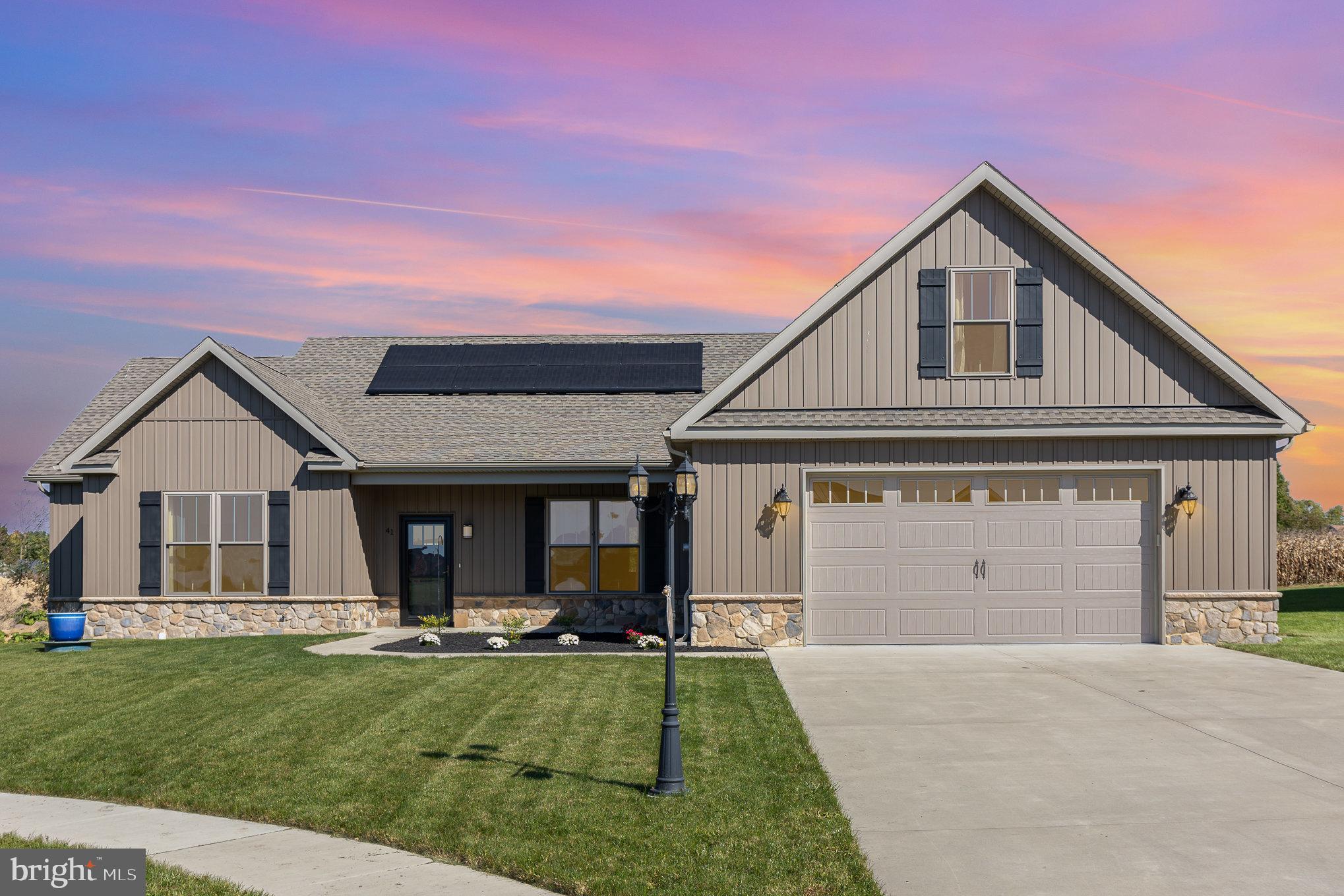 MOTIVATED SELLER!!! Welcome home!!! This Gary L Mummert Builders Custom Home, with a truly open floor plan, will make you heart skip a beat. Pretty landscaping lines the walk way to the front door. Enter through the foyer and see the show stopping stone fireplace in the living room. The beautiful kitchen with granite countertops, huge island, tons of cabinets and double wall ovens will make cooking for the upcoming holidays a breeze! All this is open to the big dining area making this home perfect for entertaining! The split bedroom floor plan is a plus for privacy too! The owner's suite has a big walk in closet and the ensuite bathroom has double sinks and a gigantic stall shower! The other side of the home has 2 more nice sized bedrooms and the full bath has a dream tub shower. Main floor laundry makes this chore easier to do. Upstairs, there is a bonus room that you can easily finish and make it a play room, bedroom, office, or whatever you need it to be. Out back there is a covered porch/patio and at the moment the yard backs to farm land. This home is a high energy efficiency home with insulated 2x6 exterior walls, solar panels with $0 electric bills most months, and LED lighting throughout. This home located at the end of a cul-de-sac in Littlestown School District won't last long!