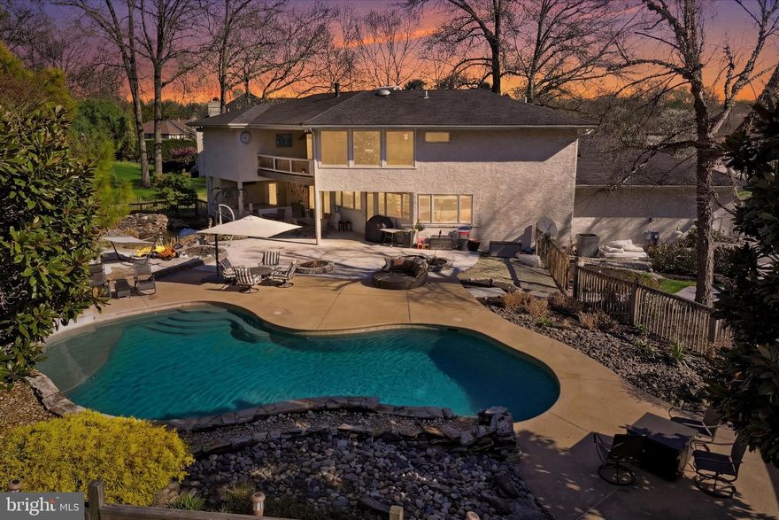 There are homes you buy. And then there are homes you feel. 1420 Ringneck Loop is the second kind. From the moment you pull into the expansive driveway and see the three-car garage, something shifts. You're not looking at a house anymore. You're standing at the entrance to a life you didn't know you were missing. Inside, the light hits differently. Oversized windows pull the sun in and the dining room wraps into the living room in a way that just makes sense — the kind of flow that makes you stop mid-tour and say, I could live here. Because you can feel it before you can explain it. The kitchen and living area were built for the way people actually live — together. Loud dinners. Quiet mornings. The indoors and outdoors blur into one seamless experience, and suddenly hosting isn't an event, it's just Tuesday. Upstairs, the primary suite will stop you cold. Step onto the private balcony with a drink in hand and watch the sun go down. Then come back inside to a steam shower that belongs in a five-star resort, double walk-in closets that every single person who has walked through this home has stopped and commented on, and a soaking tub that makes you forget what stress feels like. The hall bathroom has double sinks and if you’ve been through the morning rush, you know exactly why that matters. The lower level adds over 1,000 square feet of living space with 10-foot ceilings and natural light. A full kitchen, full bath, washer and dryer, and a private entrance make it as versatile as your imagination — an in-law suite, guest quarters, or something entirely your own. And then there's the backyard. The pool has its own waterfall. That waterfall feeds a river. That river leads to another waterfall. It's heated, fenced, and surrounded by koi, tropical plantings, and the kind of quiet that makes the rest of the world disappear. A poolside bath and shower add convenience, making every detail feel intentional and effortless. Upper Dublin School District — one of the most respected in Montgomery County. Mondauk Commons right down the road. Downtown Ambler and the train station minutes away. And I-276, Routes 309, 611, and 202 make Center City Philadelphia seamless, not a compromise. This isn't a listing. It's an invitation. Come feel what home is supposed to feel like.