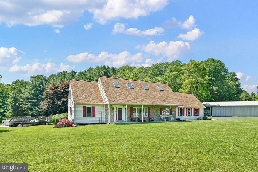 Welcome to 135 Blacksnake Rd — a lovingly and meticulously maintained 5-bedroom, 3 full and 2 half bath home offering over 4,000 square feet of living space; nestled down a long driveway on just over 4 peaceful acres in Fair Hill, MD! From the moment you walk through the front door, you are greeted by cathedral ceilings with exposed wood beams, hardwood floors, and a double-sided wood-burning fireplace that can be enjoyed from the sunken living room as well as the cozy den. 
 
Designed with both comfort and functionality in mind, this spacious home features TWO owners’ suites, including one conveniently located on the main level. The main-level primary suite offers a full bath, walk in closet, and access to the back deck and above ground pool through sliding glass doors! Continuing through the main level, the country kitchen is both charming and practical, featuring stainless steel appliances, abundant cabinet space, and plenty of room to gather! Just off the kitchen, you’ll find a separate eat-in dining room, with dining furniture included in the sale, creating a move-in ready space perfect for hosting dinners and holidays. The den includes a half bath and direct access to the covered back deck, making it the perfect space for relaxing or entertaining guests year-round. The large mudroom provides access to the attached two-car garage as well as the backyard, and is equipped with main-level laundry for everyday convenience.  
 
Moving upstairs, you’ll find four additional bedrooms, including a second owners’ suite with walk in closets and private balcony access overlooking the backyard. The en suite offers a soaking tub, double sinks, and a remote controlled skylight. There is an additional full bath on the upper level that is also equipped with a remote-controlled skylight, bringing in beautiful natural light with added convenience and modern functionality. Downstairs, the partially finished basement adds even more flexible living space and includes an additional half bath! The unfinished area provides tons of extra storage space. Major updates have already been completed, including a new roof and gutters with LeafFilter gutter guards and skylights all replaced in 2020, a new AC unit installed in 2023, new windows in 2022, newly paved and sealed driveway, and a tankless hot water heater added in 2024. If you’ve been searching for acreage, SPACE, charm, and country living, this exceptional property is one you won’t want to miss!