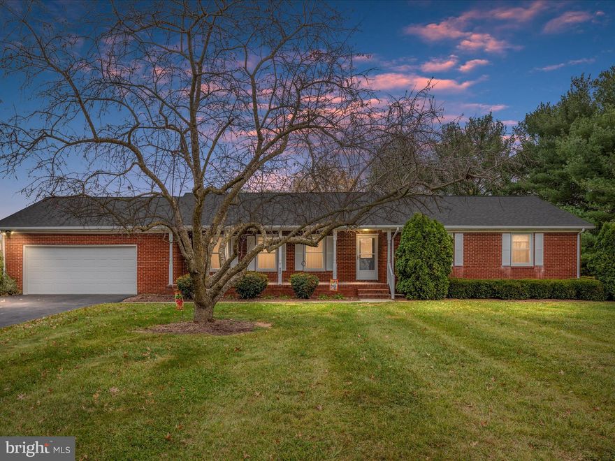 Welcome to 492 Braddock Blvd in Inwood! This classic brick rancher, set on a .79-acre flat lot, offers comfort, space, and convenience.

Inside, you’ll find 3 bedrooms and 2 full bathrooms with gleaming hardwood flooring. The kitchen features granite countertops and table space. Adjacent to the kitchen is a large dining room, perfect for hosting meals and gatherings, as well as a spacious living room with plenty of natural light.

The home also includes a cozy family room featuring a wood-burning stove with a brick mantel, creating a warm and inviting space for relaxation. Off the kitchen, a laundry room with cabinetry and storage adds convenience to daily living.

The full basement includes partially finished space with a walk-up, providing options for recreation, storage, or future expansion. Updates include a new roof and seamless gutters in 2021, along with all-new windows for improved efficiency and peace of mind.

Relax on the covered front porch or enjoy the screened back porch, ideal for outdoor living and entertaining. The yard offers plenty of space for activities, gardening, or simply enjoying the outdoors.

Located in a convenient neighborhood with easy access to local amenities, this home is ready for its next chapter. Schedule your showing today!