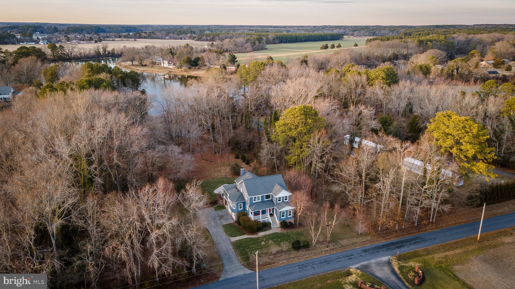 Waterfront sanctuary on 4 acres, featuring a custom coastal home by St. Maries Builders. Designed for family gatherings, the open floor plan provides spacious living across multiple levels, with ample bedrooms and baths for everyone. A rough-in is ready for a future elevator.
Crafted with quality throughout, the home boasts a gourmet kitchen with a commercial Viking stove (8 burners, 2 ovens), wood flooring on the main and upper levels, and abundant natural light. The great room features a woodstove insert, built-in bookcases, and French doors opening to a large screened porch, deck, and custom stone patio by Wentworth Nursery.
The finished basement includes a game room, bedroom, and bath. Additional highlights include an oversized garage, professional landscaping, outdoor shower, house generator, & gutter guards.
Private pier provides easy access to launch kayaks & paddle boards. Accessible to the Potomac in kayaks or small boats. Ample supply of crabs, fish & oysters in Calvert Creek. Easy car ride to nearby marinas and restaurants and is located directly across from Historic Woodlawn Manor. Ideal for year-round living, a second home, or an Airbnb. Furniture and most contents are negotiable.