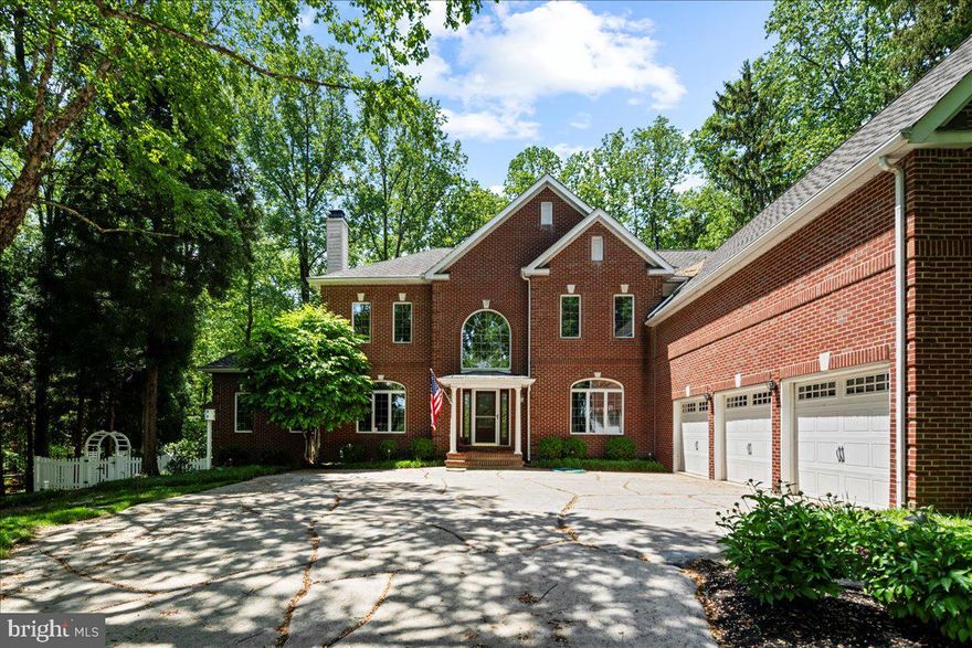 Stunning estate in the woods backing to Jericho Mountain with serene pond views. Welcome to 52 Woodside Lane, a meticulously maintained home with so many thoughtful upgrades around every corner. Dramatic 2 story foyer, Conservatory with walls of windows, see-through gas fireplace shared with neighboring Living Room, built-in speakers, and granite bar area with beverage refrigerator. Truly embrace working from home with a Study overlooking the backyard pond, 2 story Gathering Room with beautiful box beam ceiling, overlook, wood-burning fireplace, access to Sunroom addition and open to the Gourmet Kitchen with an abundance of cabinetry, enormous walk-in pantry, island with prep sink and convenient to the Butler’s pantry which will come in handy for all of those special occasions along with the connecting coffered ceiling dining room. The upper level boasts a huge Primary Suite with gas fireplace, coffered ceiling, make-up vanity nook plus an updated full Bath featuring dual private vanities, significant walk-in shower, radiant heated floors, and 4 sizeable walk-in closets. 3 additional Bedrooms, one en-suite, and another private Study with custom built-ins complete this level. The lower level is equally impressive with walk-out access and was designed to be an additional living space for in-laws or au-pair and includes a full bath, sleeping quarters, kitchen, living room with river rock surround fireplace and a craft room. Additional amenities include a whole house generator, huge low maintenance deck running the length of the home with a built-in grilling station, updated bathrooms, refinished wood floors, 4 zones for heating/cooling, 4 fireplaces, stamped concrete driveway and 3-car garage located in Upper Makefield Township within the Council Rock School District.