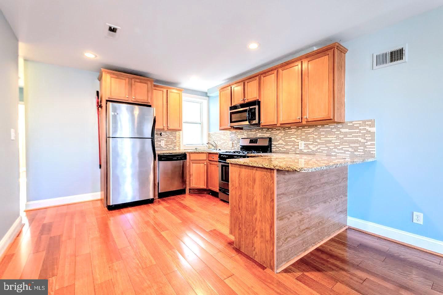 *NOW CONDUCTING VIRTUAL TOURS!!*Absolutely gorgeous bi-level condominium unit located in the Graduate Hospital neighborhood. The unit complete complete with central AC, washer/dryer, two roof decks, and a parking spot out back. The main floor opens up to a spacious kitchen, living room, and breakfast area. The kitchen features granite counter tops, tile back splash, and stainless steel appliances. A bedroom and full bathroom are also located on the first floor. Upstairs you will find the recently renovated master bedroom suite with French doors opening to a Juliet balcony, tiled bathroom with jetted tub, and separate tiled shower. The two roof decks are connected by a spiral staircase and offer incredible views of the city. The decks are a great place for a roof top garden, summer barbecues, and enjoying the outside.