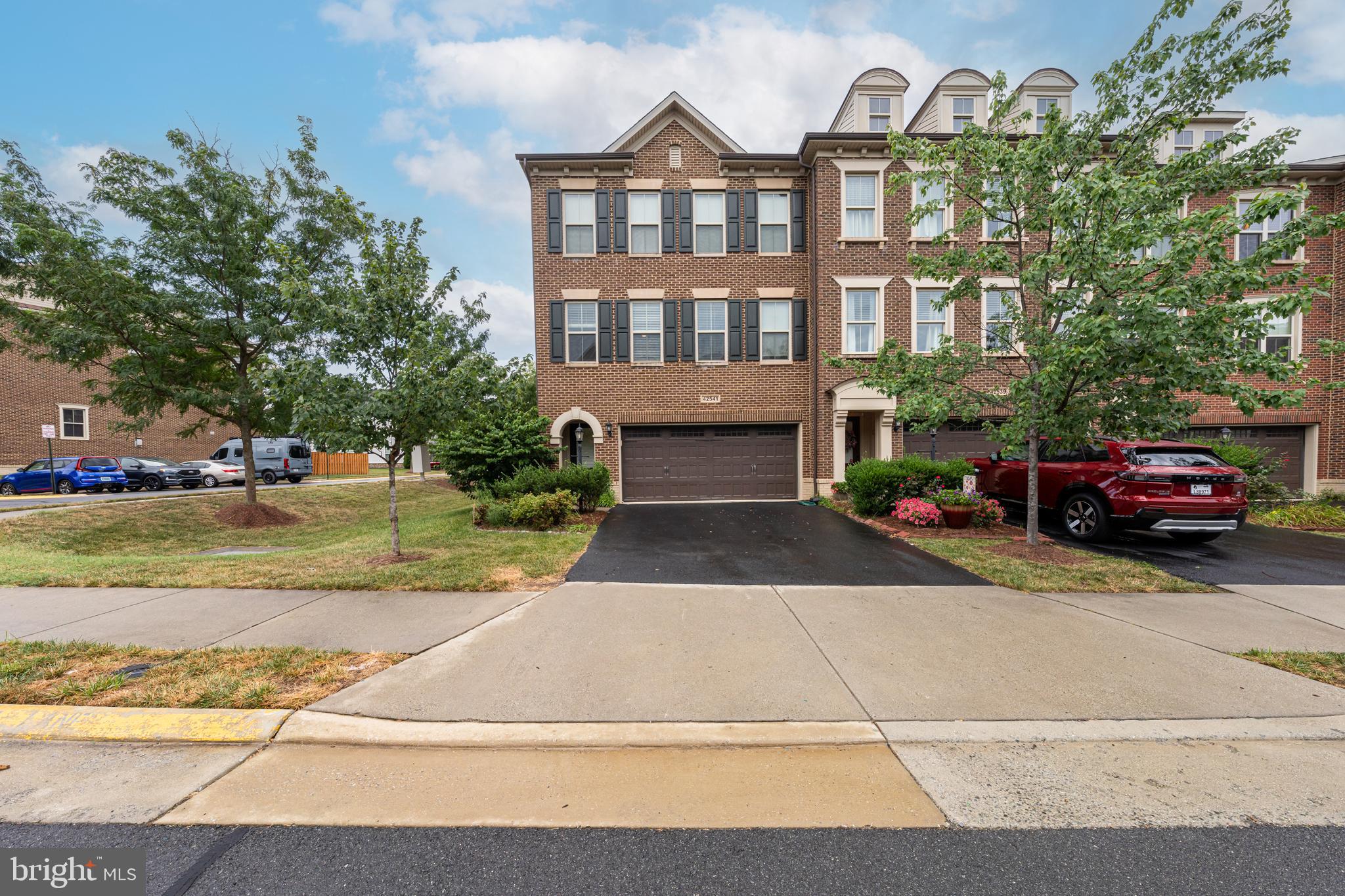 This 3-bedroom, 3.5-bath townhouse offers 3,150 square feet of finished living space across three levels, with a patio, deck, and fenced backyard.
The entry level features a welcoming staircase to the main floor. The main level offers an open layout with a formal dining room, living room, breakfast room, half bath, and kitchen with brand-new appliances. Large windows at the front and rear provide abundant natural light. The patio off the main level overlooks the green common area.
The upper level includes new carpet, a primary suite with walk-in closet, full bath with soaking tub, stand-up shower, and tile finishes. Two additional bedrooms, a second full bath, and laundry room are also on this level.
The lower level has new carpet, a large recreation room with projector and surround sound, full bath, walkout to the backyard, and access to a two-car garage with storage space.
Located near shopping centers, dining, parks, major commuter routes, the Silver Line Metro, and Dulles Airport.