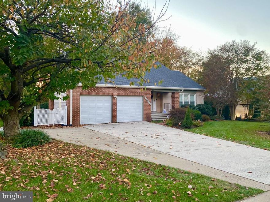 This exceptional home is situated on a beautiful lot that backs to woods in the sought-after Cavalier Woods neighborhood. It is artfully spacious  at almost 3,450 sq ft and is move-in ready. The home has been immaculately maintained and features magnificent landscaping and tasteful renovations. The inviting foyer welcomes guests as hardwood floors flow seamlessly throughout the formal living room with vaulted ceiling, dining room and family room featuring crown molding, chair railing, a wood burning fireplace, and renovated powder room. The updated kitchen boasts white cabinets, a gas cook-top, double ovens, quartz counter tops, newer appliances, a versatile island and a huge pantry that provides tons of extra storage. On the upper level you will find two guest rooms, a full-sized bath, and the primary suite with vaulted ceilings, a large en suite bath complete with a soaking tub and separate shower, 2 vanities, a large walk-in closet, and a sitting room/office/nursery with an additional closet. To make life convenient, there are laundry hookups on every level. The walk-up lower level features a mother-in-law/ au pair suite with separate kitchen, full bath, bedroom, living area, numerous closets and an additional storage room. Cavalier Woods is conveniently close to shopping, restaurants, grocery stores & gas stations, to include Trader Joe’s, Costco & Wegmans just down the street.
 Notables: Hardwoods & wooden stairs, newly tiled fireplace, renovated kitchen, newer roof with architectural shingles and 6" gutters, enclosed porch, whole house water filter, sump pump, mother-in-law suite, newer hot water heater, newer furnace, newer Pella double pane windows & more!