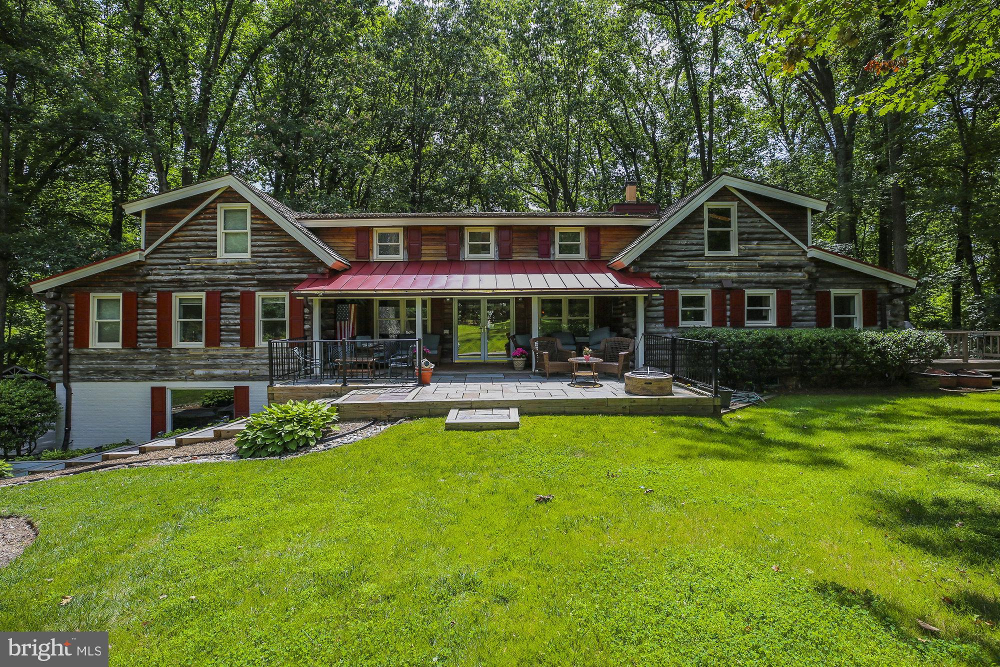 Stunning log cabin home in Windstone sited on a premium 5 acre lot. Rustic elegance with 5 bedrooms, 5 baths and 5,800 finished square feet. Hardwood flooring, wood ceilings and exposed beams make you feel like you are living in a mountain retreat, yet minutes from everything! Open and bright floor plan with a living room, gourmet kitchen, dining room, and family room with a fireplace and vaulted ceilings, perfect for entertaining or family interaction. Main level living with an owner’s retreat, sitting room and a newly updated spa-like bath and an additional bedroom and full bath. The upper level features three bedrooms, one with a wood fireplace and two newly updated full baths with dual sinks. Finished walk-out lower level with a recreation room, game room, laundry room and full bath. A backyard sanctuary on 5 acres, perfect for outdoor living, featuring a covered front porch, patio, fire pit, expansive back deck, and in-ground pool. Side load three car garage and 600 ft private drive. Convenient location with easy access to trails, parks, Metro, Reston Town Center, Vienna, Tysons, Dulles Airport and more! Westbriar/Kilmer/Marshall pyramid