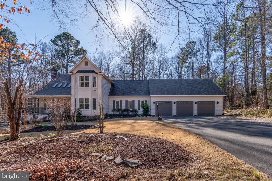 Absolutely stunning! This beautifully updated 4-bedroom home sits on 2.2 acres, just 18 minutes from Short Pump. Enjoy the serenity and charm of the wrap-around porch. The kitchen boasts a GE Cafe gas cooktop, electric oven, and a newer KitchenAid refrigerator, flowing into a dining area with a wood-beamed cathedral ceiling, one of two family rooms. Anderson and Pella windows flood the home with natural light. The first-floor primary bedroom is spacious at 22x13, complemented by a fully remodeled bath featuring Quartz counters, heated Venetian stone floors, an open shower, and a large Jacuzzi tub with an additional heater. Plus, a sizable walk-in closet and a Rinnai tankless water heater for endless hot water. Need space for a large vehicle? The oversized doors on the 3-car garage are perfect. A trail behind the property leads to the South Anna River, and there's even a chicken coop with resident hens for fresh eggs daily. This property is meticulously maintained and thoughtfully designed!