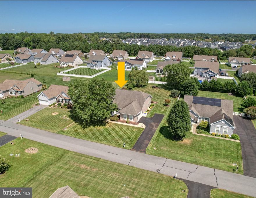 Welcome to The Ridings at Rehoboth – Where Comfort Meets Coastal Living!

Discover the best of one-level living in this beautifully maintained Beazer-built Prestwick model, ideally situated on a meticulously landscaped 0.47-acre lot. From the moment you arrive, the charming front porch invites you to relax and connect with neighbors as they stroll through this welcoming community.

Inside, a bright, open foyer with hardwood floors and elegant crown molding sets the tone, flanked by a formal dining room—which could easily be converted into an office or additional bedroom—and two spacious guest bedrooms that share a full hallway bath. The heart of the home is the expansive great room, offering cathedral ceilings, a gas fireplace with upgraded insert and glass, a ceiling fan with light, and a wall of windows that flood the space with natural light. The adjoining gourmet eat-in kitchen is ideal for entertaining, featuring granite countertops, a tile backsplash, propane gas cooking, double islands, and a walk-in pantry.

Just off the kitchen, a sunny breakfast area leads to the sunroom and out to a generous 16' x 24' Trex deck with a built-in gas hookup for grilling, as well as a paver patio that overlooks the private, landscaped backyard—perfect for outdoor living and entertaining. The owner's suite offers a peaceful retreat with two walk-in closets and a spacious en-suite bath complete with double vanities and an oversized tiled shower.

Additional features include a well-equipped laundry room with built-in cabinetry, an oversized side-load two-car garage with plenty of storage space and a second refrigerator, and a four-foot conditioned (heat and air conditioned) crawl space with exterior access—ideal for storing seasonal items. For added peace of mind, the home includes a whole-house generator, Rinnai tankless water heater, newer propane furnace and HVAC system, and upgraded seven-inch gutters. An irrigation system with your own personal well and pump ensures your lawn and landscaping stay lush year-round at no added cost.

The Ridings at Rehoboth offers an array of community amenities, including scenic ponds with fountains, an outdoor pool, a clubhouse with a fitness room, and a calendar full of community events. All this, just minutes from the beaches of Rehoboth and Lewes, as well as top-rated restaurants, shopping, and coastal attractions.

Start living your best beach life today in this exceptional home at The Ridings at Rehoboth!

Take the video tour!