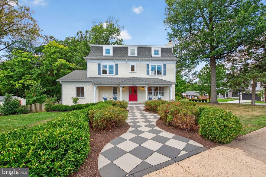 Welcome to 2828 N. Van Buren, a one-of-a-kind residence in the heart of Arlington that blends historic charm with modern design & remarkable flexibility. Rebuilt in 2017, this extraordinary property was intentionally crafted as a multigenerational home, featuring both a Main House and a fully independent Auxiliary Dwelling Unit (ADU)—a rare find in Arlington. With its own Certificate of Occupancy, the ADU operates as a true home of its own, complete with a private entrance, fully equipped kitchen, laundry, heating and cooling, and a spacious bedroom suite. Perfect for grandparents, an au pair, extended family, a dedicated home office, or an income-producing rental, the ADU makes this property as versatile as it is beautiful.

Set on a desirable corner lot, the house immediately impresses with its vintage double front doors, lovingly restored and painted a striking pomegranate red, and a winding, garden-flanked walkway that feels lifted from Alice in Wonderland. Inside, a welcoming vestibule separates the entrances to each home, offering privacy while keeping everyone connected under one roof. Nine-foot ceilings, gleaming hardwood floors, new furnace, plantation shutters, new carpet,  new LVP floors, & fresh neutral paint throughout give every room a crisp, move-in ready appeal. The Main House features a gracious, sun-drenched living room, an elegant dining room with pocket doors and statement chandeliers, and a show-stopping chef’s kitchen with shaker cabinets, granite counters, hand-painted Portuguese tile, a five-burner Italian gas range with pot filler, & a central island with seating. French doors lead from the kitchen to a sunny deck and backyard, perfect for entertaining.

Upstairs, the primary suite offers a serene retreat with hardwood floors, a walk-in closet, and a spa-like bath featuring a clawfoot tub, a walk-in shower with dual showerheads, double marble vanity, & a private water closet. Two additional bedrooms share a thoughtfully designed bath with dual vanities and a separate tub and shower room. The lower level provides even more flexible living with a bright family room, a bedroom/office with built-ins, a bonus room ideal for a gym or guest space, a large laundry room, & two massive storage rooms—ready to be customized to your needs.

The Auxiliary Dwelling Unit is equally impressive, with its own welcoming foyer, living room with gas fireplace, French doors to a private deck, and a stylish kitchen w/ shaker cabinetry, quartz counters, modern lighting, & a striking tile backsplash behind the gas range. The bedroom suite includes a walk-in closet and a spa-inspired bath with imported tile, glass-enclosed shower, & marble vanity. A second room w/ custom built-ins and pocket doors offers the perfect office, guest space, or reading nook, & a private laundry area completes this independent home.

Outside, the landscaped yard bursts w/ charm, from hydrangeas and tiger lilies to apple trees and flowering shade trees. A fenced backyard w/ patio space provides both beauty and function, while the front porch—w/ its ceiling fans and timeless character—is the perfect place to enjoy morning coffee or evening wine. The one-car garage and long driveway provide plenty of parking.

Beyond the property itself, the location is unbeatable. Nestled at the intersection of two quiet, tree-lined streets, this home is within walking distance of Tuckahoe Elementary, neighborhood parks, and the East Falls Church Metro, offering quick access to DC, Tysons, & Dulles. Farmers markets, highly rated restaurants, shops, and libraries are minutes away, making everyday life convenient & enjoyable.

Featured in Arlington Magazine, Viva Tysons, and Home & Design for its unique design and thoughtful functionality, this home is as special as it is rare. If you’ve been searching for a property that combines timeless character, modern upgrades, & true flexibility for multigenerational living or rental potential, 2828 N. Van Buren is it!