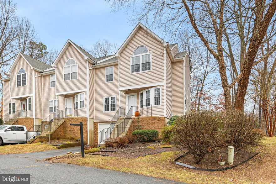 There's no place like home!  This move-in ready, end-unit townhome in the Chesapeake Club is a great mix of convenience and comfort, and is only a few minutes from downtown North East, where you can find shopping, dining, waterfront activities, parks, and more. Inside the home, the main level has an open layout that feels spacious, with a cozy gas fireplace that makes the living areas warm and inviting. There’s also a sunroom with a sliding glass door, providing a nice place to relax all year round. The kitchen is modern and impressive, featuring stainless steel appliances, granite countertops, a stylish tile backsplash, and a large island that's great for cooking and entertaining. Upstairs, you'll find two large bedrooms, both with new carpeting for extra comfort. The primary suite is a true getaway, complete with access to a private balcony, a walk-in, cedar-lined closet, and a bathroom that has a luxurious jetted tub, a stand-up shower, and dual sinks. This townhome not only offers stylish living but is also conveniently located near all the attractions of North East and local commuter routes. Don’t miss the chance to make this beautiful property your new home!