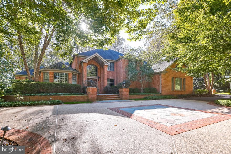 Rarely does one have the opportunity to secure a custom property like this - sited on a very private 1.69 acre lot adjacent to state parkland. Total finished area in this home is over 9000 square feet with classic architectural features on display at every turn. This level of craftmanship and millwork is seldom found. The owners spared no time or expense to create a design masterpiece.  The home features coffered ceilings throughout, inlayed woodwork, complimenting crown moldings, chair rails, and classic oversized baseboards.  Soaring ceilings accent the timeless built-ins that are featured on all levels and especially shine in the main floor grand family room and in the lower level great room.  The main level great room flows easily through light-filled sliding doors to the custom redwood deck and patio. 
This home boasts two full gourmet kitchens with custom cabinetry and stunning layouts. High end appliances are found in both kitchens along with built-in wall ovens and gourmet gas ranges. Spectacular lighting packages are a highlight of the home and add that special feel to every room. Stunning hardwood floors are featured on all levels with an especially rich style and quality on the lower level.  Expansive bedrooms on each level boast large light-filled windows with unique design elements which need to be seen to be appreciated. Every season of the year will bring unique and glorious views to the indoors.  Additionally featured is a children's imagination room that will melt your heart. This unique area with age-appropriate access rarely grants adults the privilege of entering. Older folk need to be on their best behavior to be invited in! The owner has lovingly created a spectacular art room which opens to a private stone patio. This special space will take you away from the cares of the world and invite you to explore your creative side.
The secluded and tranquil grounds feature extensive landscaping and spectacular hardscaping elements that feature custom stonework and architecturally designed elevations. A summer favorite will be the large pool with spa and waterfall feature. This special area which ties seamlessly to the lower-level kitchen and great room will be host to many grand gatherings of family and friends.  Outdoor living in this stunning oasis will be enjoyed for many years.