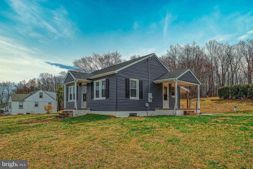 Beautifully updated 2-bedroom, 2-bathroom bungalow with stylish modern upgrades completed at the end of 2023! The newer installed cabinets, stainless steel appliances, quartz countertops, and LVP flooring add a sleek, contemporary touch. Downstairs, a spacious recreation room, bonus room, and additional bathroom provide extra living space, versatility, and the potential for a private en suite. Fresh interior paint, along with newer vinyl siding and a recently replaced roof (both updated in 2023), enhance durability and energy efficiency. The expansive backyard, featuring a fire pit, is perfect for outdoor gatherings and relaxing evenings. Ideally located just five miles from up and coming Culpeper!