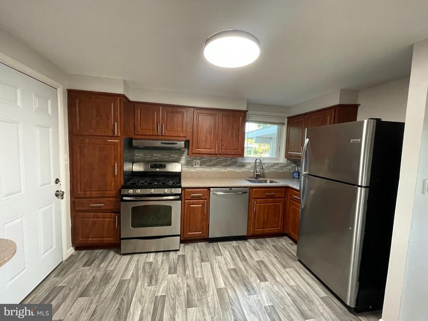 Welcome home to this charming, spacious 3BR, 1.5. Bath home nestled in the Mt. Washington/Pikesville neighborhood! This open floor plan creates a seamless flow between the living room, dining area, kitchen making it perfect for both relaxation and entertaining. Updated eat-in kitchen with stainless steal appliances, ample counter space, and sleek cabinetry that provides plenty of storage. Finished basement with additional storage space, full size washer and dryer. Lush beautiful landscape with attached large gated back yard  and adjacent driveway.