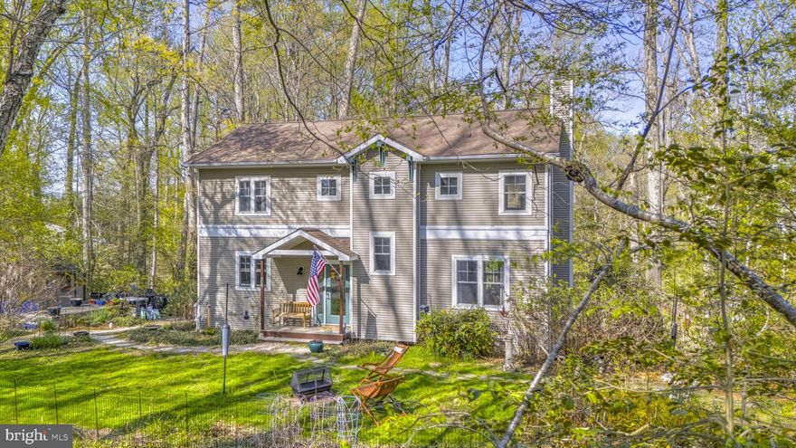 Come experience this beautiful home set on a private 1.42-acre lot in the water-privileged community of Edgewater Beach. The spacious kitchen features silestone countertops and overlooks the dining area and living room, where a cozy wood-burning fireplace creates the perfect setting for chilly evenings. A private main-level office offers a quiet retreat for work or study, and hardwood floors flow throughout the main level. Step outside to the rear deck—an ideal place to relax and enjoy nature, complete with abundant wildlife. Upstairs, the primary suite boasts a sitting area and private bath, along with two additional bedrooms, a full hall bath, and a convenient washer and dryer. The lower level includes a generous family room, a fourth bedroom (no closet), and a storage area. From here, step out to the large screened rear porch—perfect for entertaining or unwinding. This one-of-a-kind property offers privacy along with access to exceptional community amenities, including a beach pavilion, pier with boat slips, boat launch, and kayak racks. Enjoy a short stroll or bike ride to nearby shopping and more.