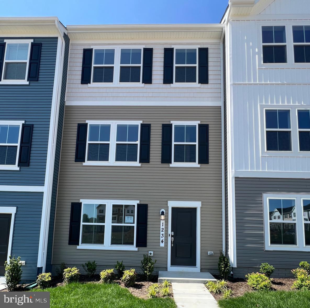 Be the first to call this beautifully crafted townhome your home, located in the desirable and expanding Red Clover Meadows community in Ranson, WV. Enjoy scenic views overlooking future community green space from this prime location.
This Harriett floor plan features three thoughtfully designed levels, including:
A spacious rear-load 2-car garage with an oversized driveway
3 bedrooms and 2.5 bathrooms
A flexible lower-level space—perfect for a home office, gym, or playroom
An extended 10' x 18' deck, ideal for outdoor entertaining or relaxing
Inside, you'll find a modern open-concept kitchen with granite countertops, tile backsplash, upgraded cabinetry, and a full suite of stainless steel appliances. The main living area boasts 9-foot ceilings and stylish contemporary finishes throughout.
Convenience is key with an upstairs laundry area featuring a washer and dryer on the bedroom level.
Commuters will love the easy access to Route 9, with quick connections to Frederick, MD, Winchester, VA, and Loudoun County, VA. Plus, you’re just minutes from shopping, dining, and daily conveniences.
Don’t miss out—call today to schedule your private tour. This brand-new home won’t stay on the market for long!